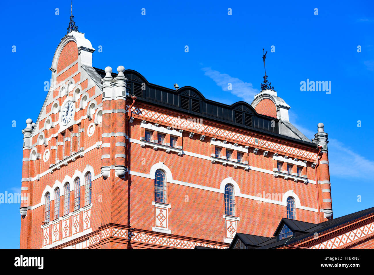 Ahus, Sweden - March 20, 2016: Architectural detail of the Absolut Company factory, the place where Absolut Vodka is made. Red b Stock Photo