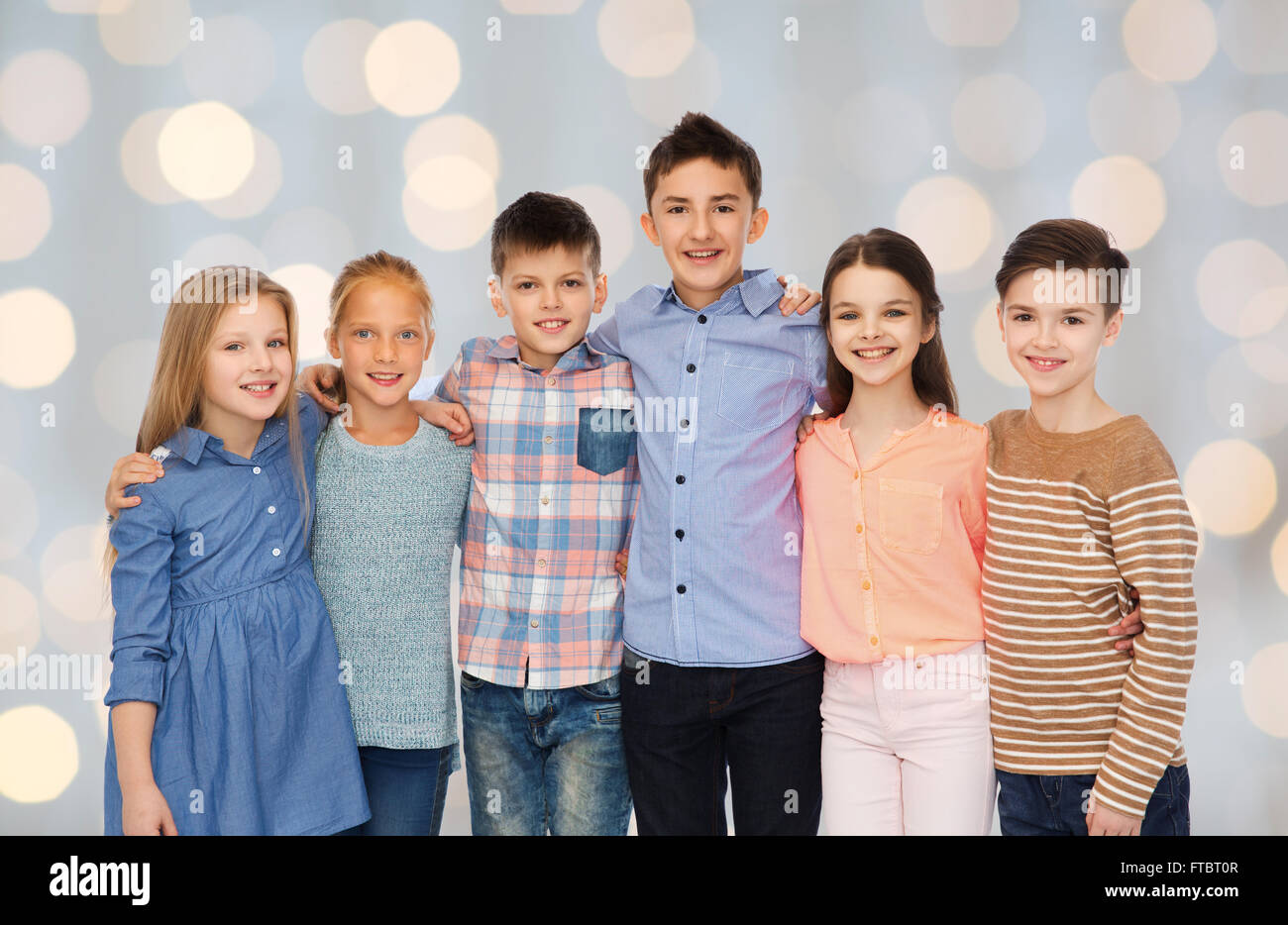 happy smiling children hugging Stock Photo - Alamy