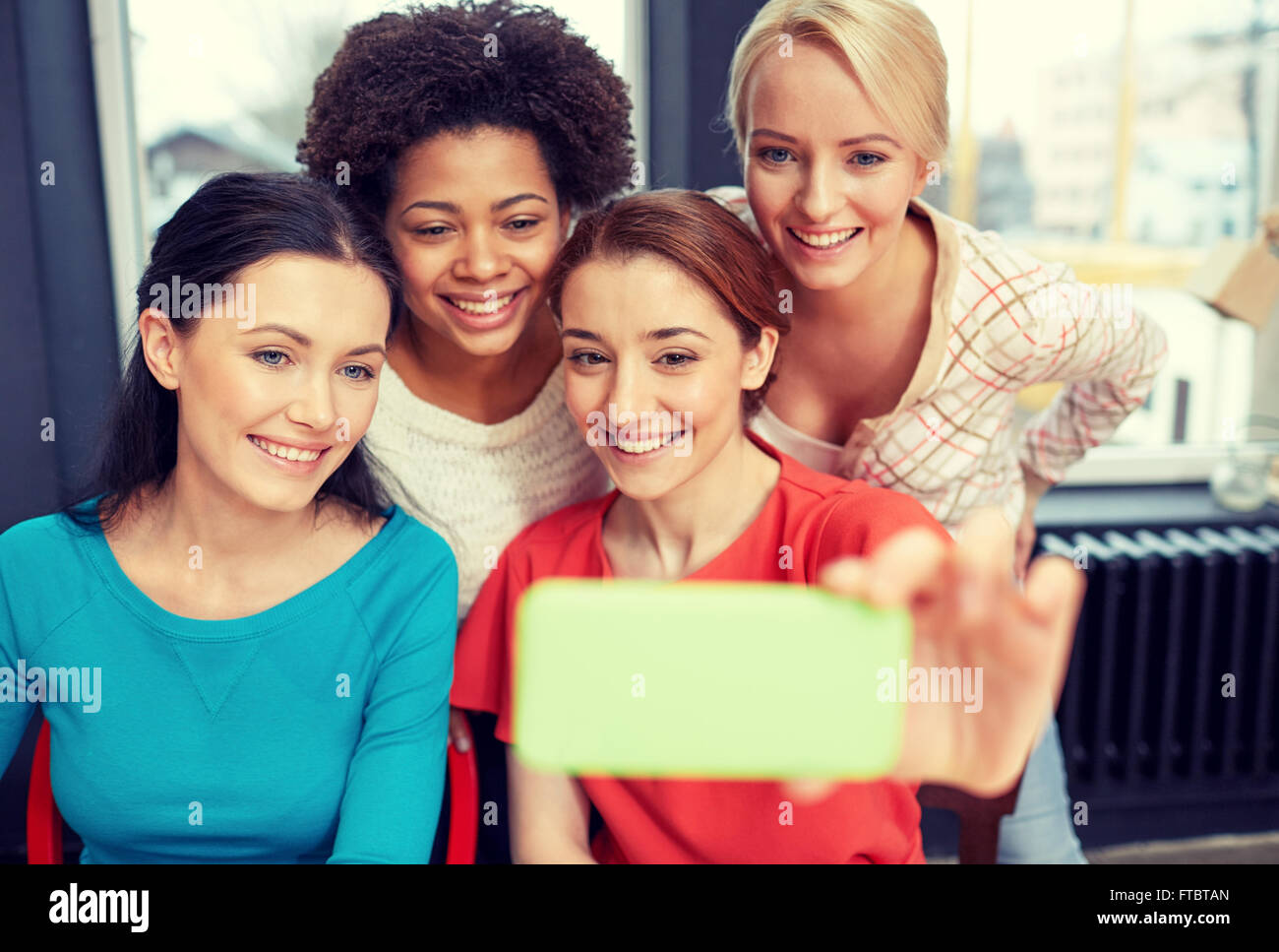 happy young women taking selfie with smartphone Stock Photo - Alamy