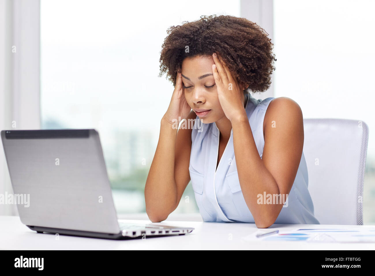 african woman with laptop at office Stock Photo - Alamy