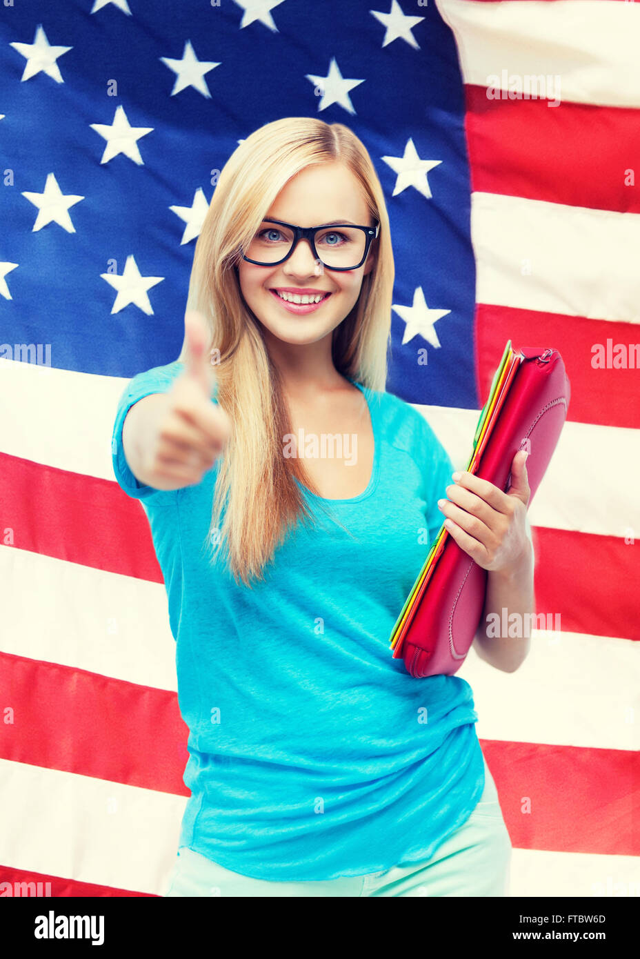 smiling student with folders Stock Photo - Alamy