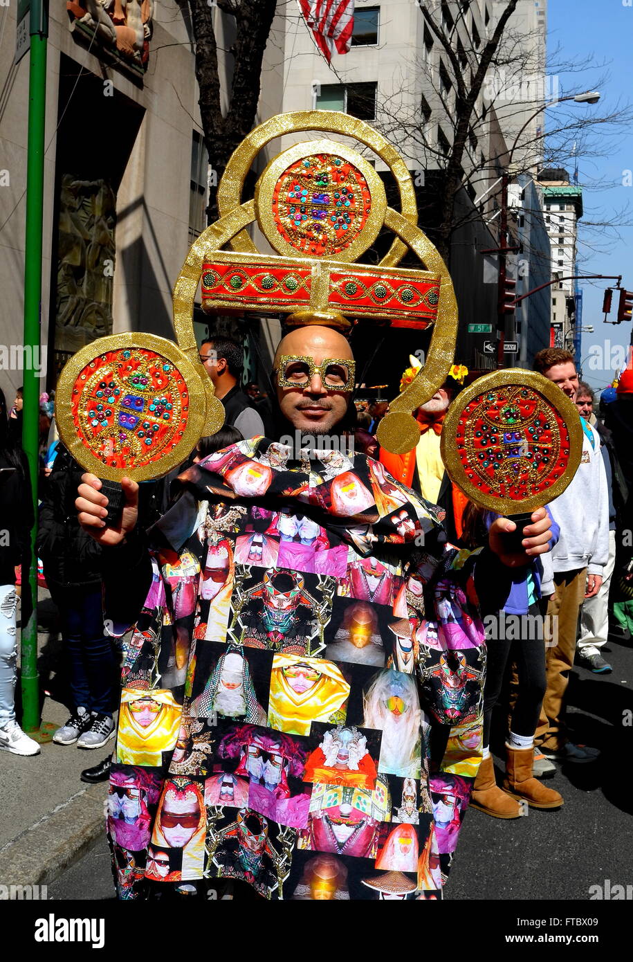 New York City - March 27, 2016:  Man wearing a colourful jacket and imaginative head gear at the Fifth Avenue Easter Parade  * Stock Photo