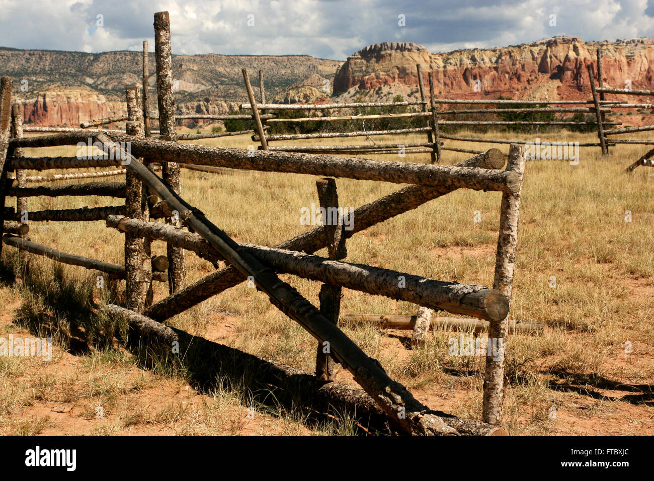 Wooden corral and mountains at Ghost Ranch, New Mexico Stock Photo