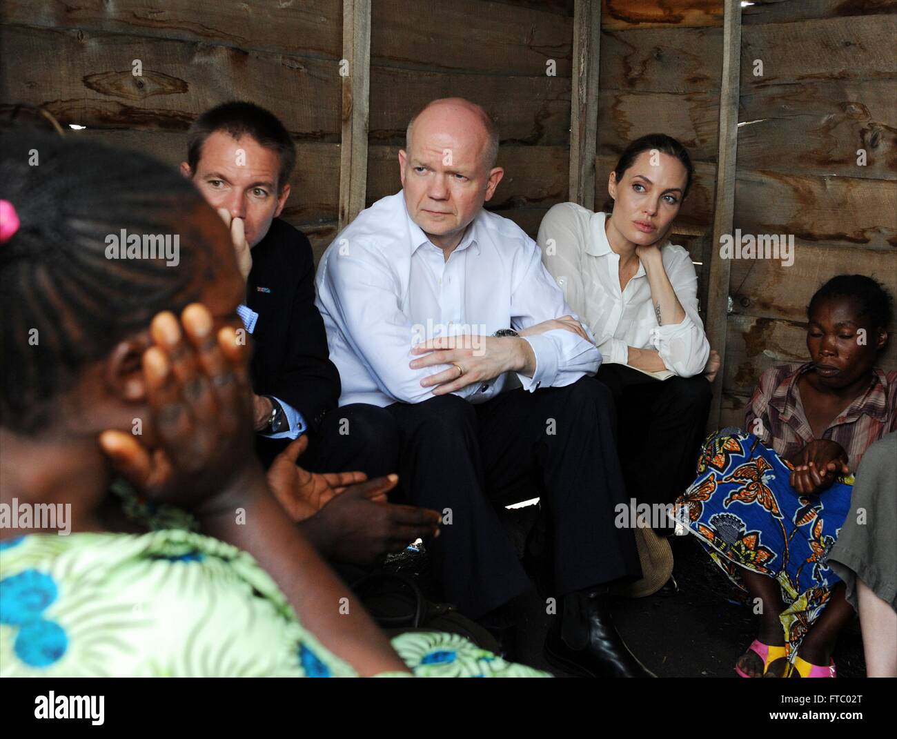 Former United Kingdom Foreign Secretary William Hague and actress and U.N Special Envoy Angelina Jolie Pitt visit the visit Nzolo refugee camp March 24, 2013 in Goma, Democratic Republic of Congo. Stock Photo