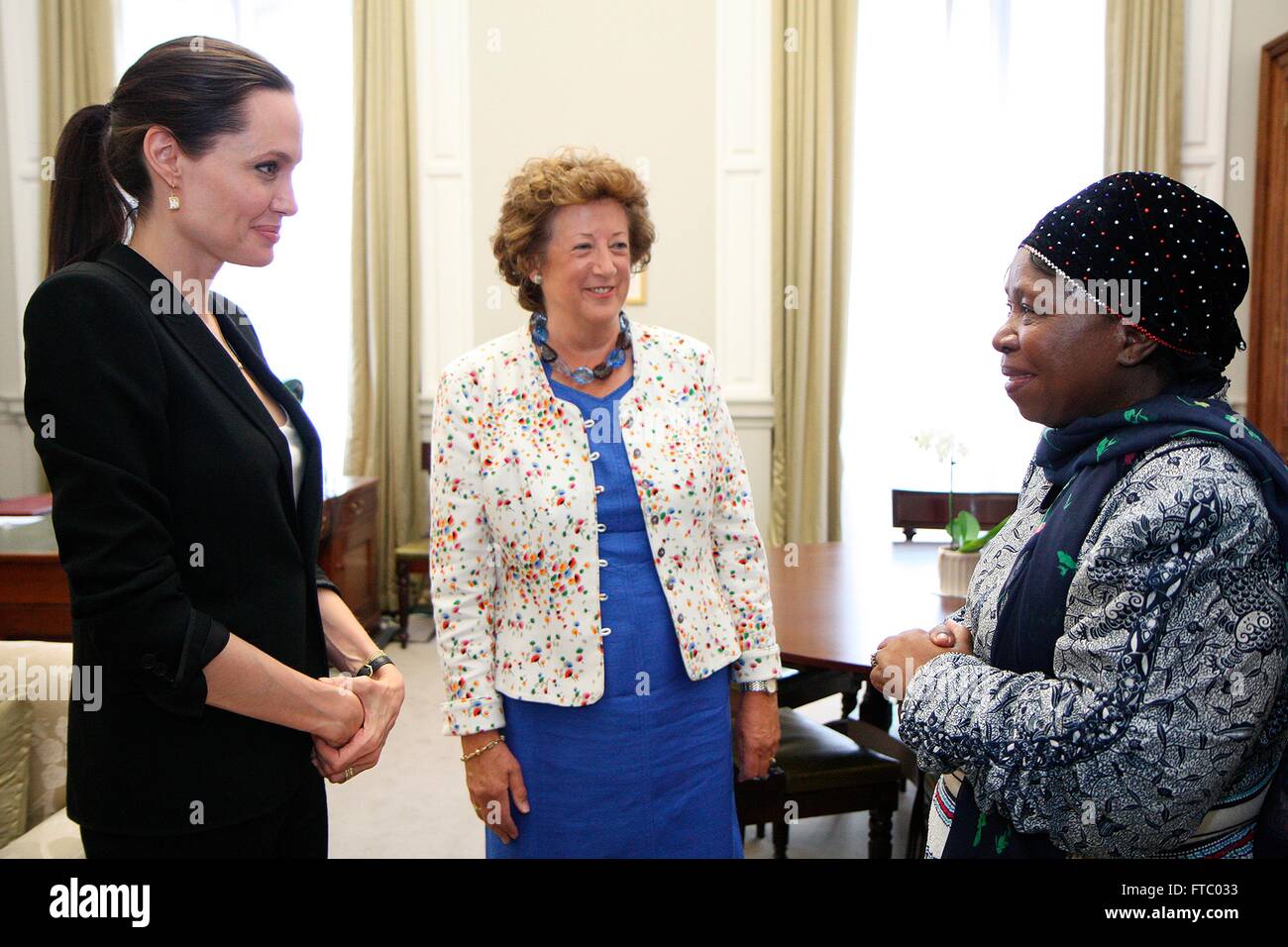 United Kingdom Foreign Office Minister Baroness Anelay, center, meets with actress and U.N Special Envoy Angelina Jolie Pitt and Dr. Nkosazana Dlamini Zuma, Chairperson of the African Union Commission June 26, 2015 in London. Stock Photo