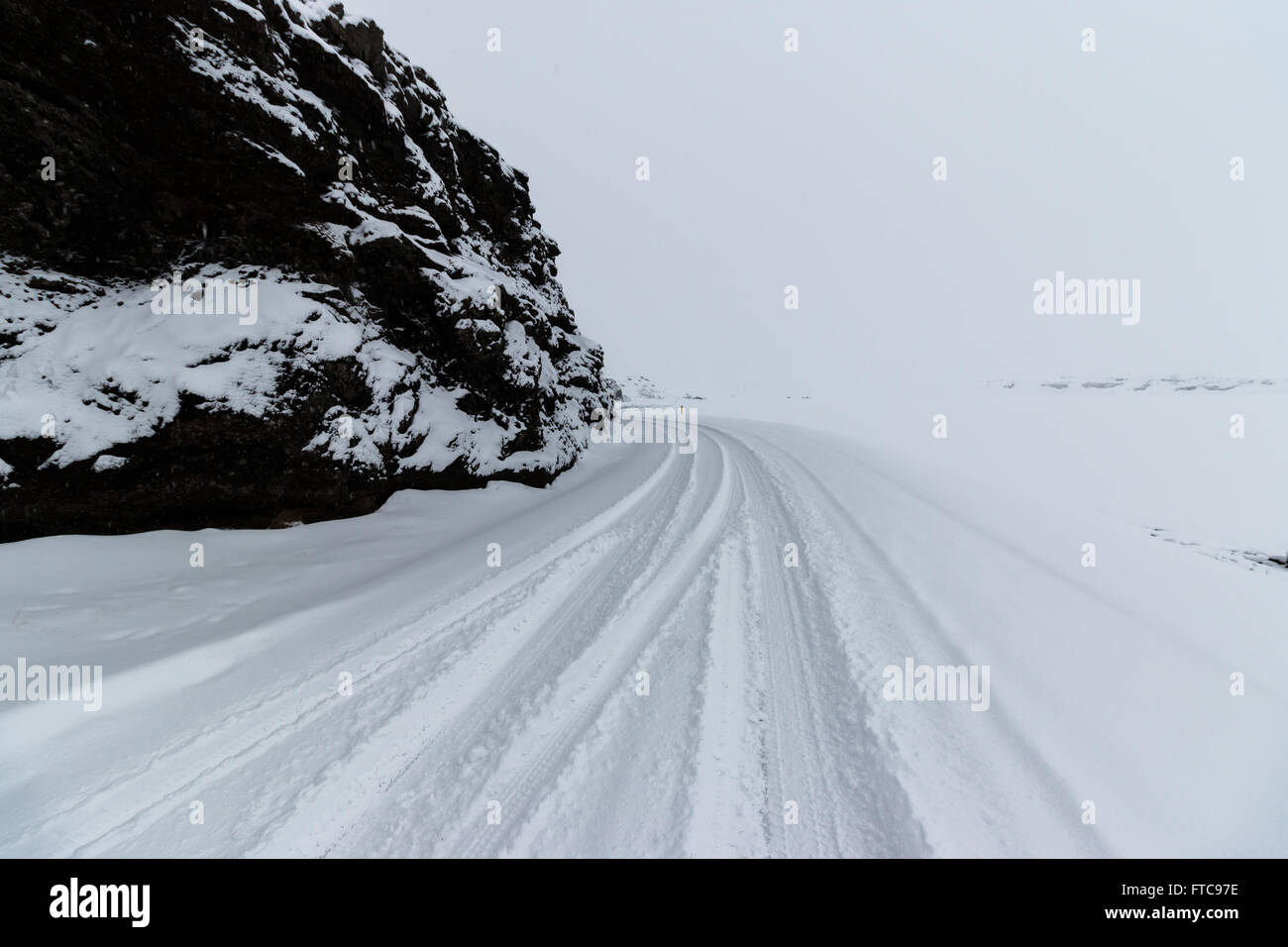 road covered in snow.  Kleifarvatn, Iceland.  close to Reykjavik and Keflavik. Stock Photo