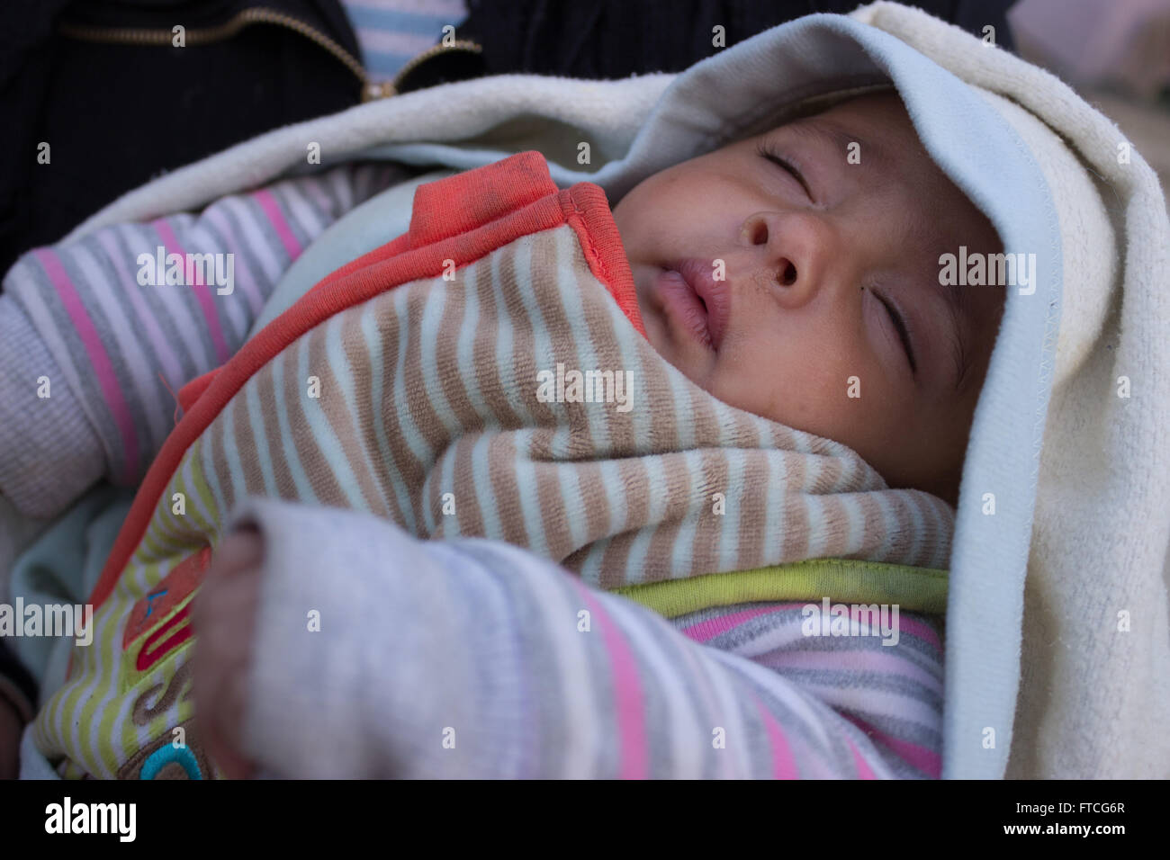 Idomeni, Greece. 26th March, 2016. After the closure of the Greek-Skopje borders, sealing the Western Balkan route, followed by the announcement of the Greek government asking refugees, to vacate Ideomeni transit camp, a large group of refugees departed to other camps in Greece while others decided to stay and demonstrate against the route sealing at the Greek-Skopje state borders,  On March 28th the GR vice secretary called refugees carrying over Euros 250.000 to invest in Greece!. Images from Paoenia municipality, Kilkis, Central Macedonia. Credit:  Vassilis Triantafyllidis/Alamy Live News Stock Photo