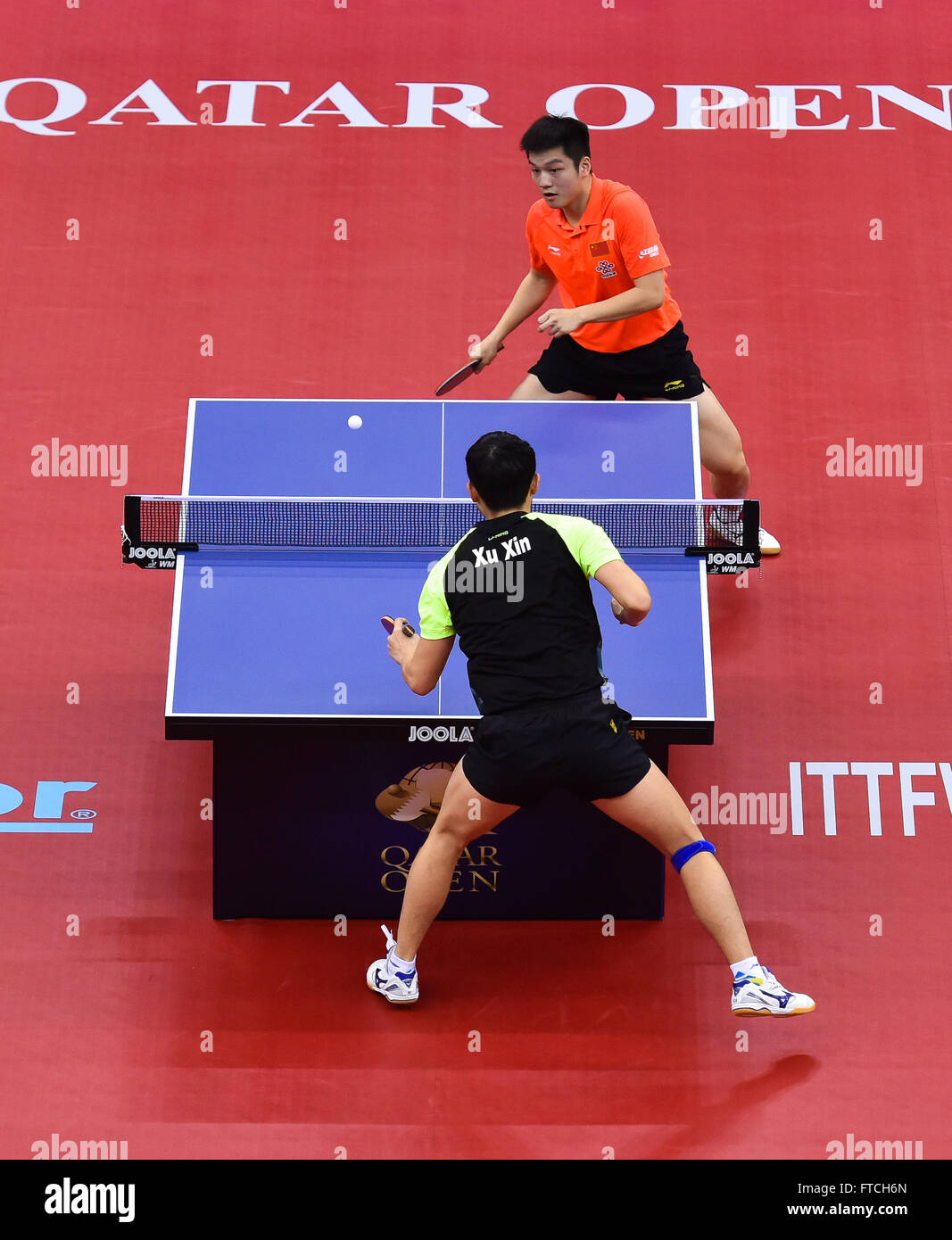 Doha, Qatar. 27th Mar, 2016. Fan Zhendong(Top) of China competes during the  semi-final of men's singles against Xu Xin of China at the 2016 ITTF World  Tour Qatar Open table tennis tournament