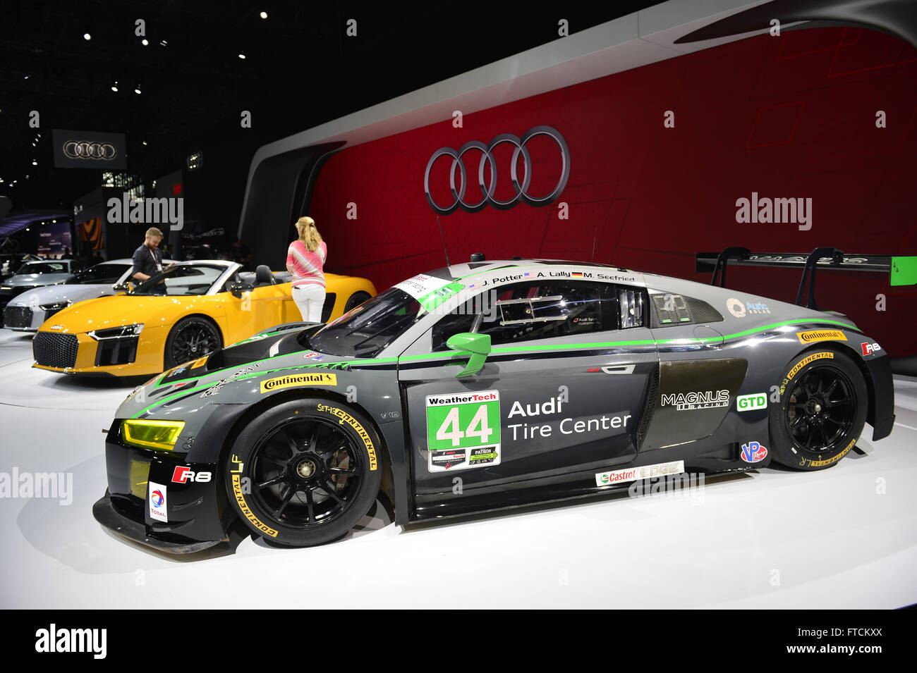 March 23, 2016 - Manhattan, New York, United States - A silver Audi R8 LMS V10 endurance racer, and yellow Audi R8 Spyder V10 making its world premiere , are shown at the New York International Auto Show 2016, at the Jacob Javits Center. This was Press Preview Day one of NYIAS, and the Trade Show will be open to the public for ten days, March 25th through April 3rd. (Credit Image: © Ann Parry via ZUMA Wire) Stock Photo