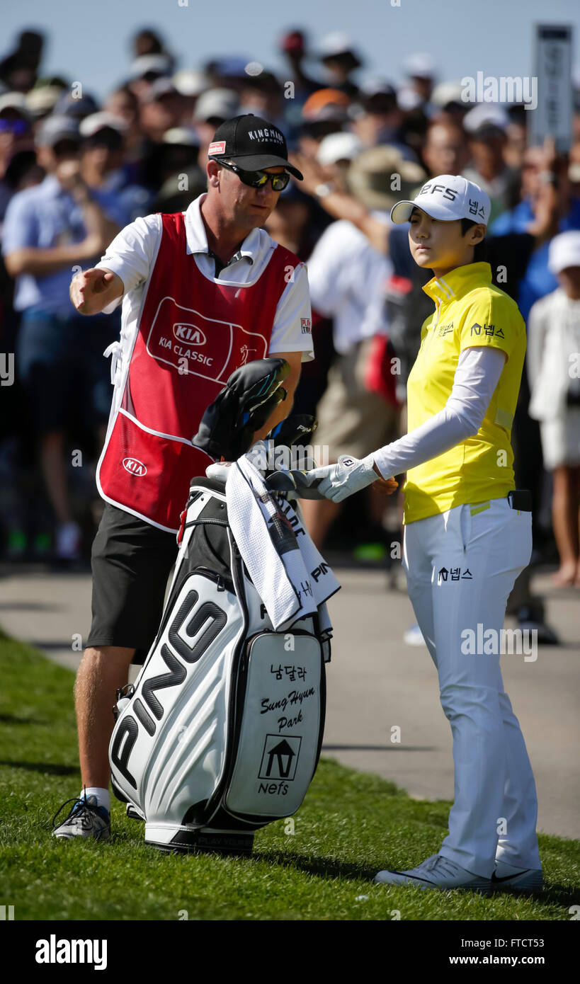 Carlsbad, California, USA. 27th Mar, 2016. Sung Hyun Park talks with her caddie after a rules official assists with the spotting of her ball during the final round of the Kia Classic at Aviara Golf Club in Carlsbad, California. Lydia Ko wins by 19 under for the tournament. Justin Cooper/CSM/Alamy Live News Stock Photo