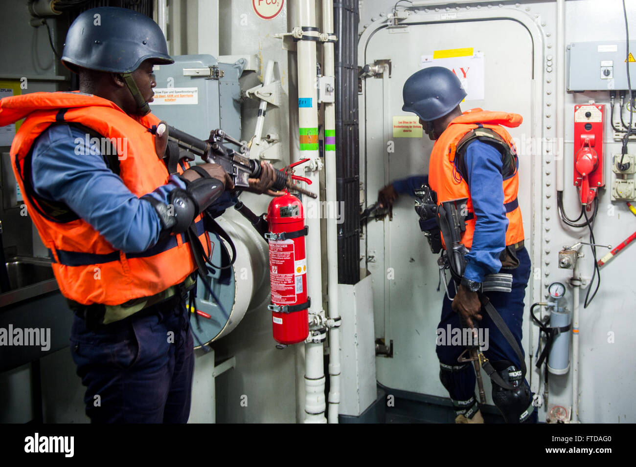 150323-N-EZ054-071 GULF OF GUINEA (March 23, 2015) Ghanaian navy boarding team members prepare to breach a door aboard the German navy target vessel FGS Brandenburg (F215) during a weapons trafficking scenario as part of Exercise Obangame Express 2015, March 23. Obangame Express is a U.S. Africa Command-sponsored multinational maritime exercise designed to increase maritime safety and security in the Gulf of Guinea. (U.S. Navy photo by Mass Communication Specialist 3rd Class Luis R. Chavez Jr/Released) Stock Photo