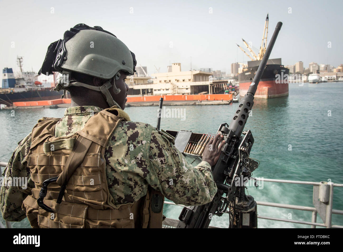 150417-N-EC444-121 DAKAR, Senegal (April 17, 2015) Boatswain’s Mate Seaman Cheeseman Johnson, from Charlotte, North Carolina, stands security watch aboard the Military Sealift Command’s joint high-speed vessel USNS Spearhead (JHSV 1) April 17, 2015. Spearhead is on a scheduled deployment to the U.S. 6th Fleet area of operations in support of the international collaborative capacity-building program Africa Partnership Station. (U.S. Navy photo by Lt. Sonny Lorrius/Released) Stock Photo