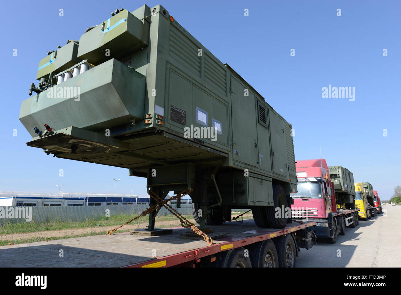 150418-N-TQ904-001 NAVAL SUPPORT FACILITY DEVESELU, Romania (April 18, 2015) A line of portable generators await installation at Naval Support Facility Deveselu, Romania, April 18, 2015. Members of the U.S. Army Corps of Engineers 249th Engineer Battalion transported the generators from Fort Belvoir, Virginia, and installed them into Deveselu’s Aegis Ashore facility. (U.S. Navy photo by Lt. Cmdr. Mike Billips/Released) Stock Photo