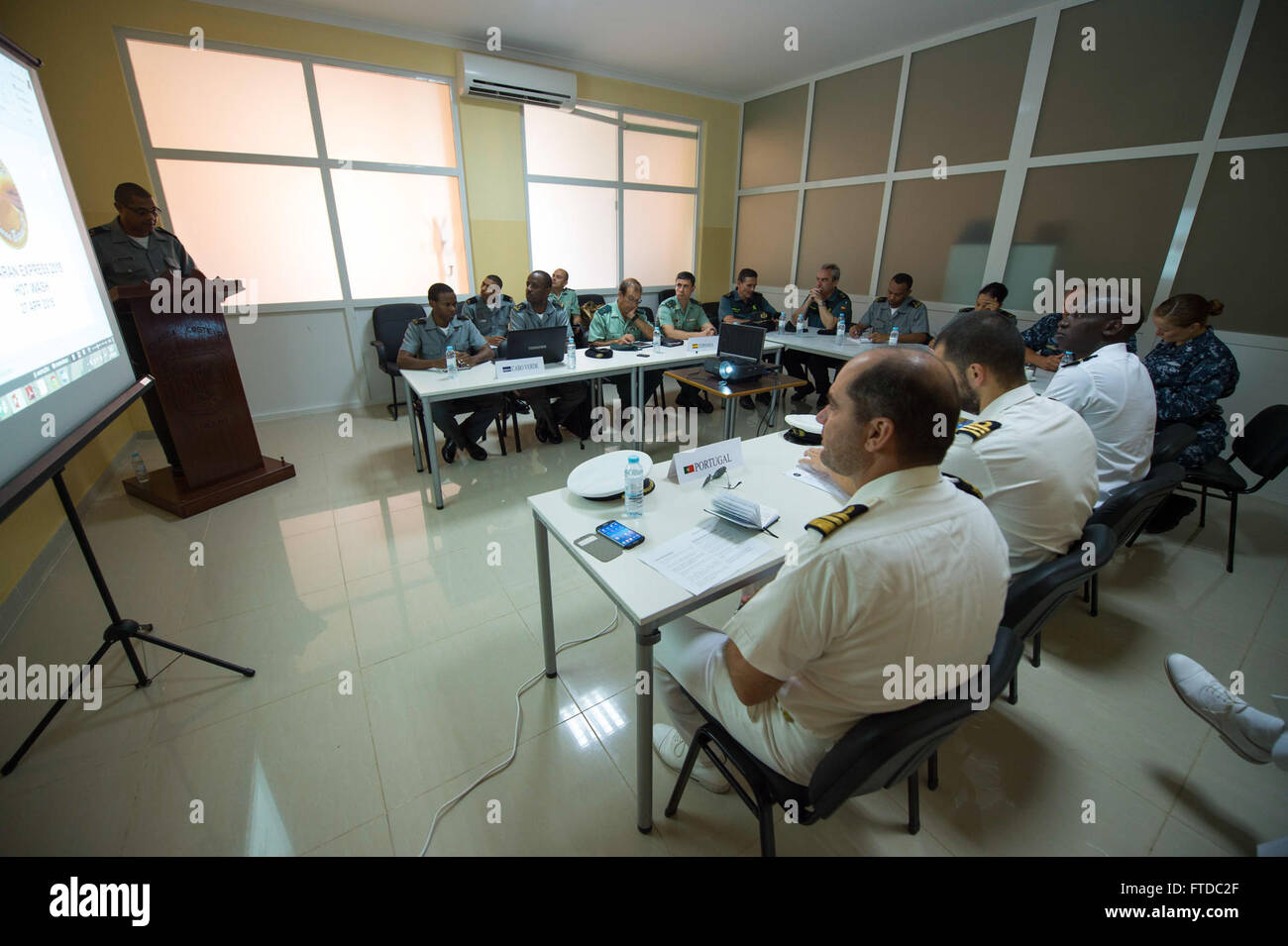 150427-N-TC720-026 MINDELO, Cabo Verde (April 27, 2015) Maritime forces from Spain, Cabo Verde, Senegal, Portugal and the United States conduct a closing brief in Mindelo, Cabo Verde, which concluded Exercise Saharan Express 2015, April 27. Saharan Express is a U.S. Africa Command-sponsored multinational maritime exercise designed to increase maritime safety and security in the waters of West Africa. (U.S. Navy photo by Mass Communication Specialist 3rd Class Mat Murch/Released) Stock Photo