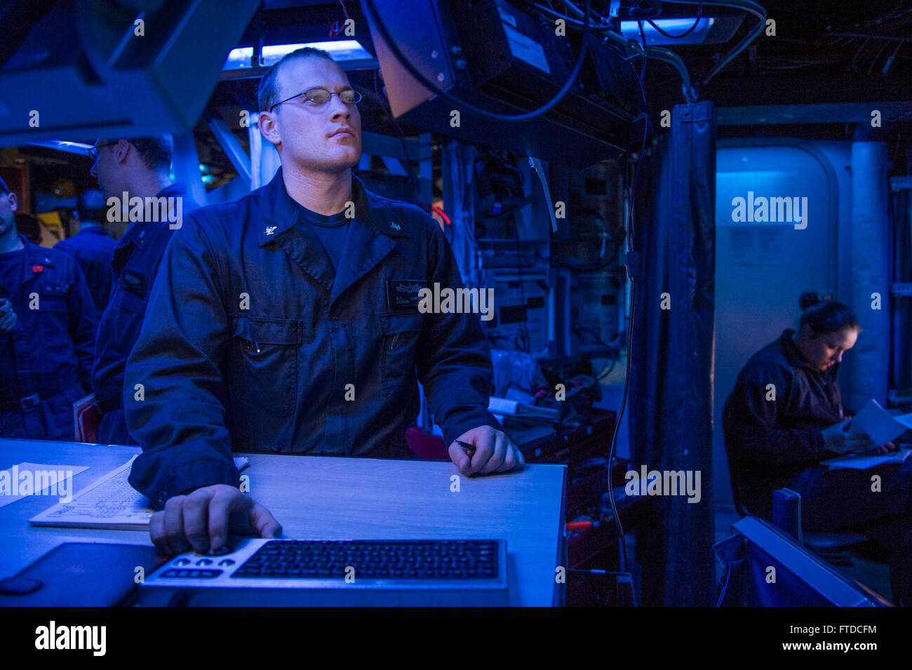 150512-N-XB010-049 MEDITERRANEAN SEA (May 12, 2015) Operations Specialist 3rd Class Brandon Kubinski manages the log for the ship’s position using the voyage management system aboard USS Laboon (DDG 58) May 12, 2015. Laboon, an Arleigh Burke-class guided-missile destroyer, homeported in Norfolk, is conducting naval operations in the U.S. 6th Fleet area of operations in support of U.S. national security interests in Europe. (U.S. Navy photo by Mass Communication Specialist 3rd Class Desmond Parks/Released) Stock Photo