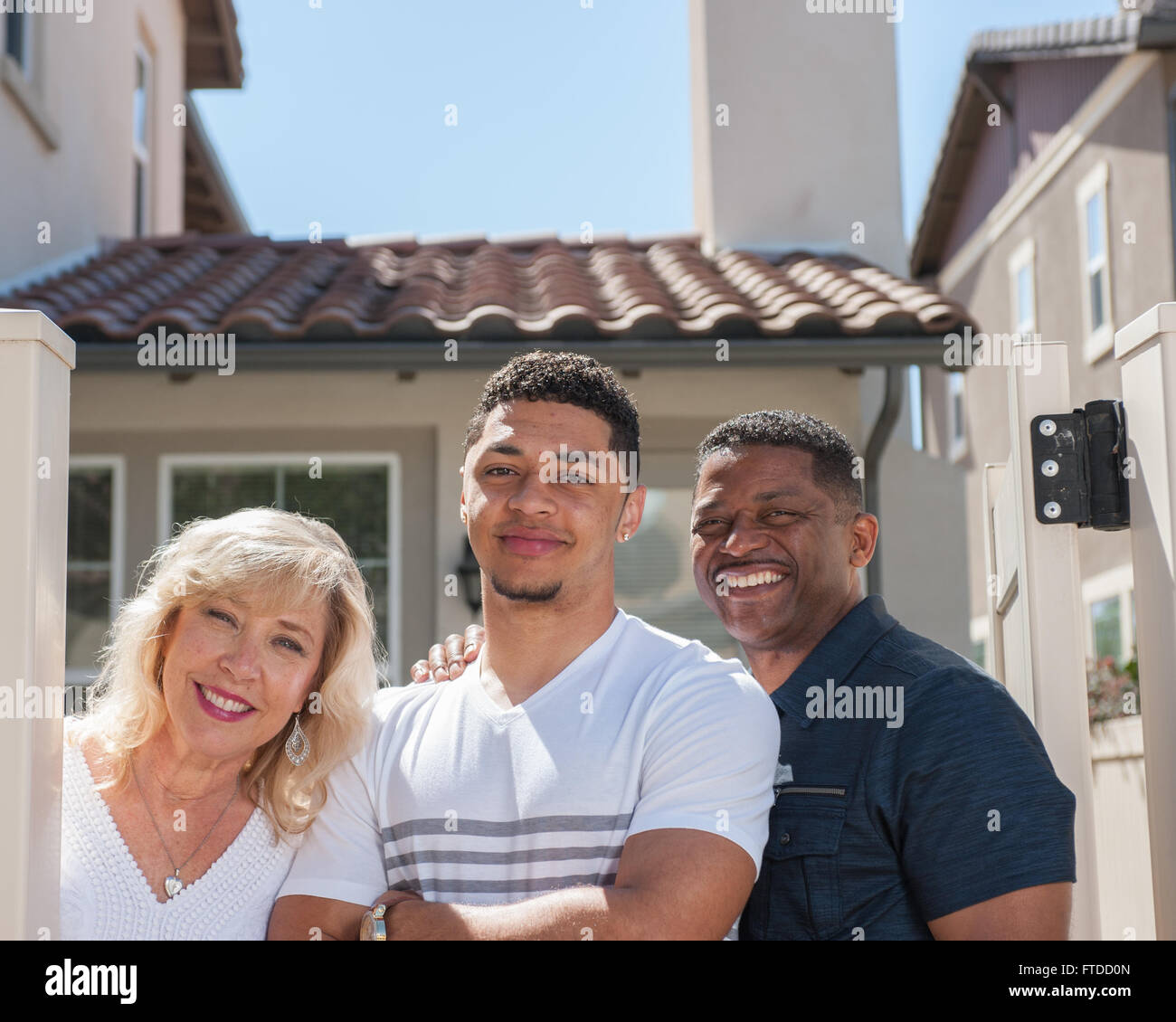 Happy mixed ethnic family faces posed in backyard Stock Photo Alamy