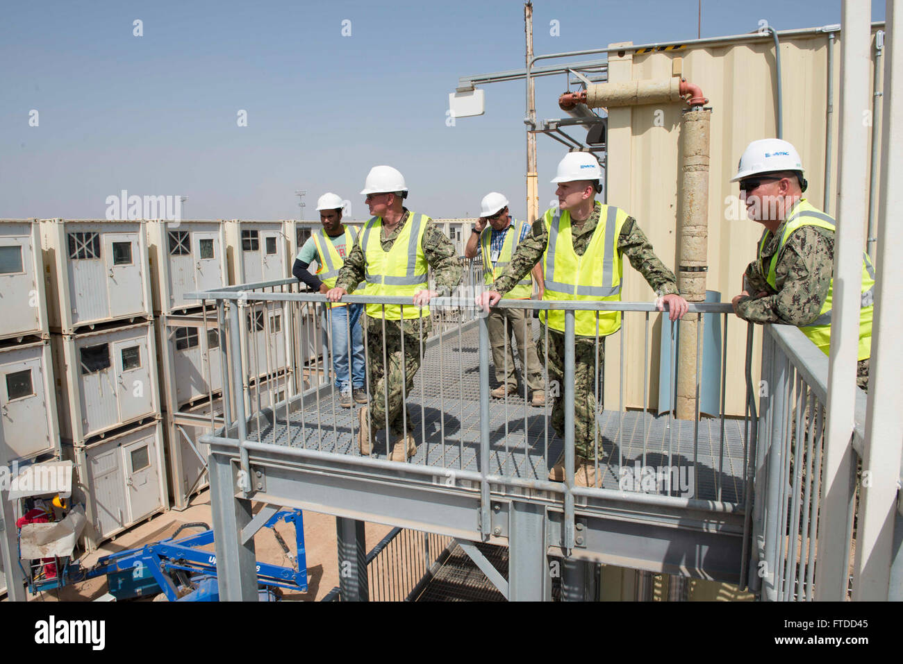 150603-N-OX801-105 CAMP LEMONNIER, Djibouti (June 3, 2015) Naval Forces Europe-Africa Fleet Master Chief Steven Giordano, second from right, tours Camp Lemonnier facilities and living establishments with Command Master Chief  Scott Martin, left, and Senior Chief Construction Mechanic Jamie Warwick during a visit to Camp Lemonnier, Djibouti, June 3, 2015. Giordano's visit to Camp Lemonnier and Combined Joint Task Force-Horn of Africa locations served to better understand the commands' quality of work and quality of life, as well as recognizing exemplary Sailors within each command. (U.S. Navy p Stock Photo