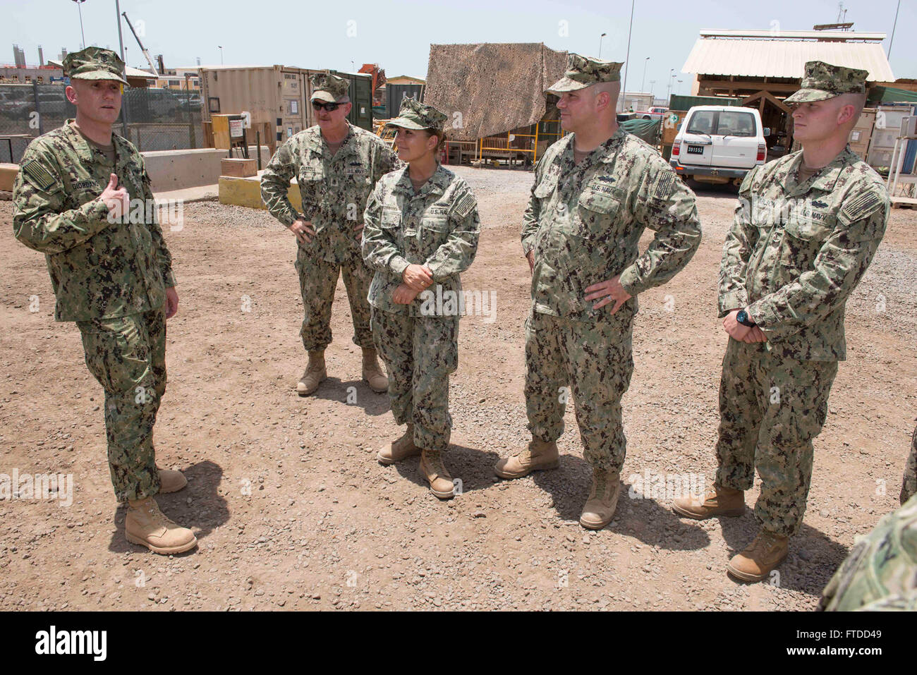 150603-N-OX801-274 CAMP LEMONNIER, Djibouti (June 3, 2015) Naval Forces Europe-Africa Fleet Master Chief Steven Giordano, left, speaks with Seabees assigned to Naval Mobile Construction Battalion 14 during his visit to Camp Lemonnier in Djibouti, Africa, June 3, 2015. Giordano's visit to Camp Lemonnier and Combined Joint Task Force-Horn of Africa locations served to better understand the commands' quality of work and quality of life, as well as recognizing exemplary Sailors within each command. (U.S. Navy photo by Mass Communication Specialist 2nd Class Daniel P. Schumacher/Released) Stock Photo