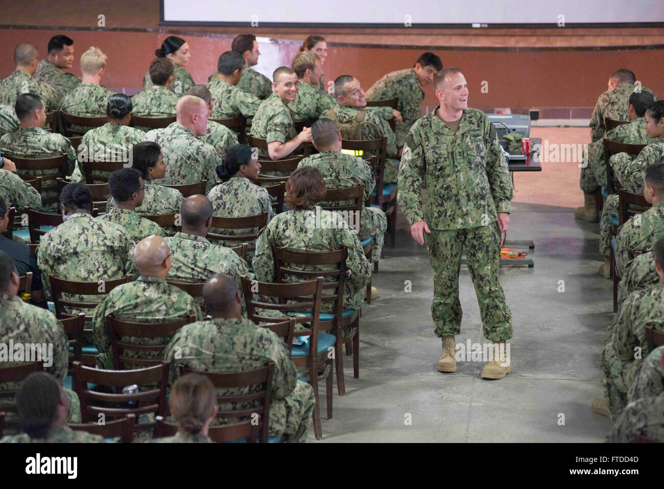 150603-N-OX801-371 CAMP LEMONNIER, Djibouti (June 3, 2015) Naval Forces Europe-Africa Fleet Master Chief Steven Giordano speaks to Sailors at an all-hands call during his visit to Camp Lemonnier in Djibouti, Africa, June 3, 2015. Giordano's visit to Camp Lemonnier and Combined Joint Task Force-Horn of Africa locations served to better understand the commands' quality of work and quality of life, as well as recognizing exemplary Sailors within each command. (U.S. Navy photo by Mass Communication Specialist 2nd Class Daniel P. Schumacher/Released) Stock Photo