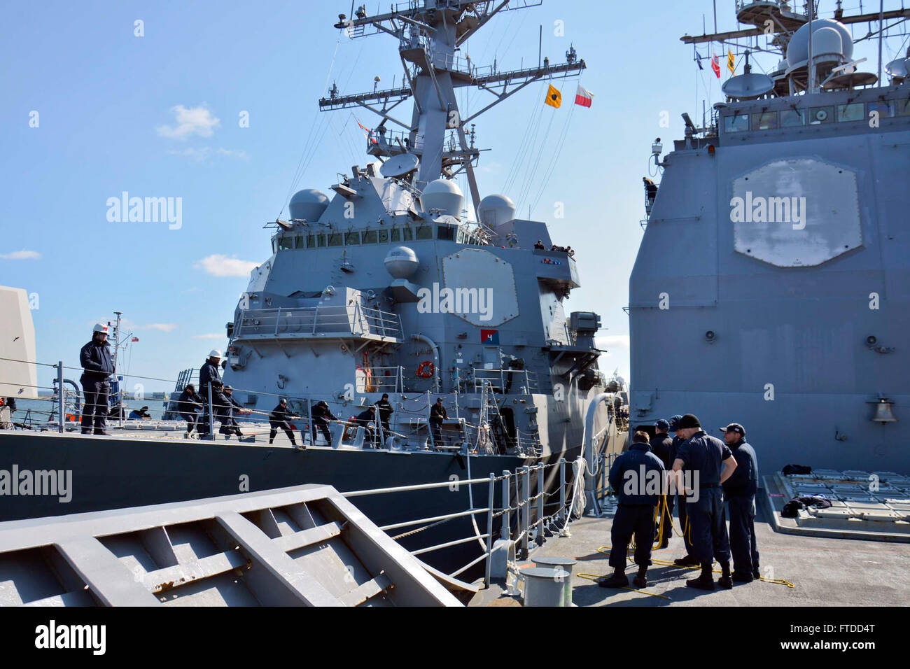 150604-N-IY633-034 GDYNIA, Poland (June 4, 2015) – USS Jason Dunham (DDG 109), left, moors alongside Standing NATO Maritime Group 2 (SNMG2) flagship USS Vicksburg (CG 69) in Gdynia for a port visit in preparation for exercise Baltic Operations (BALTOPS) 2015. BALTOPS is an annually reoccurring multinational exercise designed to enhance flexibility and interoperability, as well as demonstrate resolve of Allied and partner forces to defend the Baltic region. (U.S. Navy photo by Mass Communication Specialist 2nd Class Amanda S. Kitchner/Released) Stock Photo