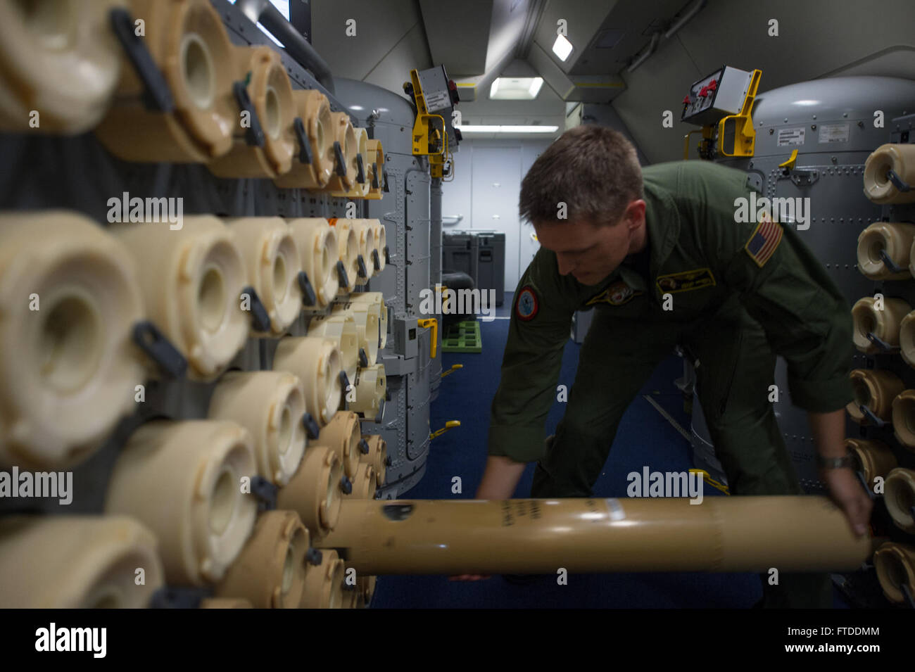 U.S. Navy Chief Petty Officer Jason Heupel, Patrol Squadron Eight electronic warfare operator discards an empty sonobuoy container during a BALTOPS 2015 mission over the Baltic Sea June 13, 2015.Sailors aboard the aircraft use sonobuoys to conduct anti-submarine warfare and underwater acoustic research. Seventeen NATO and partner nations are participating in the 43rd iteration of the multinational maritime exercise BALTOPS 2015 in Poland, Sweden, Germany, and throughout the Baltic Sea. (U.S. Air Force photo by Staff Sgt. Christopher Ruano/Released) Stock Photo