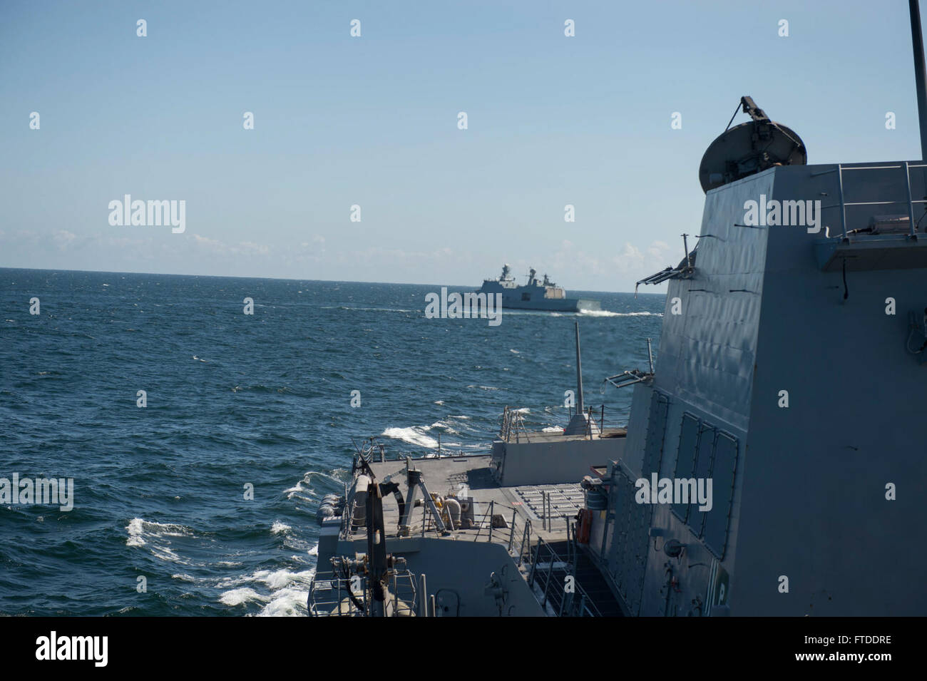 150615-N-ZE250-098 BALTIC SEA (June 15, 2015) Danish Navy Frigate HDMS Absalon (L16) maneuvers behind USS Jason Dunham (DDG 109) June 15, 2015. Jason Dunham, an Arleigh Burke-class guided-missile destroyer homeported in Norfolk, is participating in exercise Baltic Operations (BALTOPS) 2015. BALTOPS is an annually recurring multinational exercise designed to enhance flexibility and interoperability, as well as demonstrate resolve of Allied and partner forces to defend the Baltic region. (U.S. Navy photo by Mass Communication Specialist 3rd Class Weston Jones/Released) Stock Photo