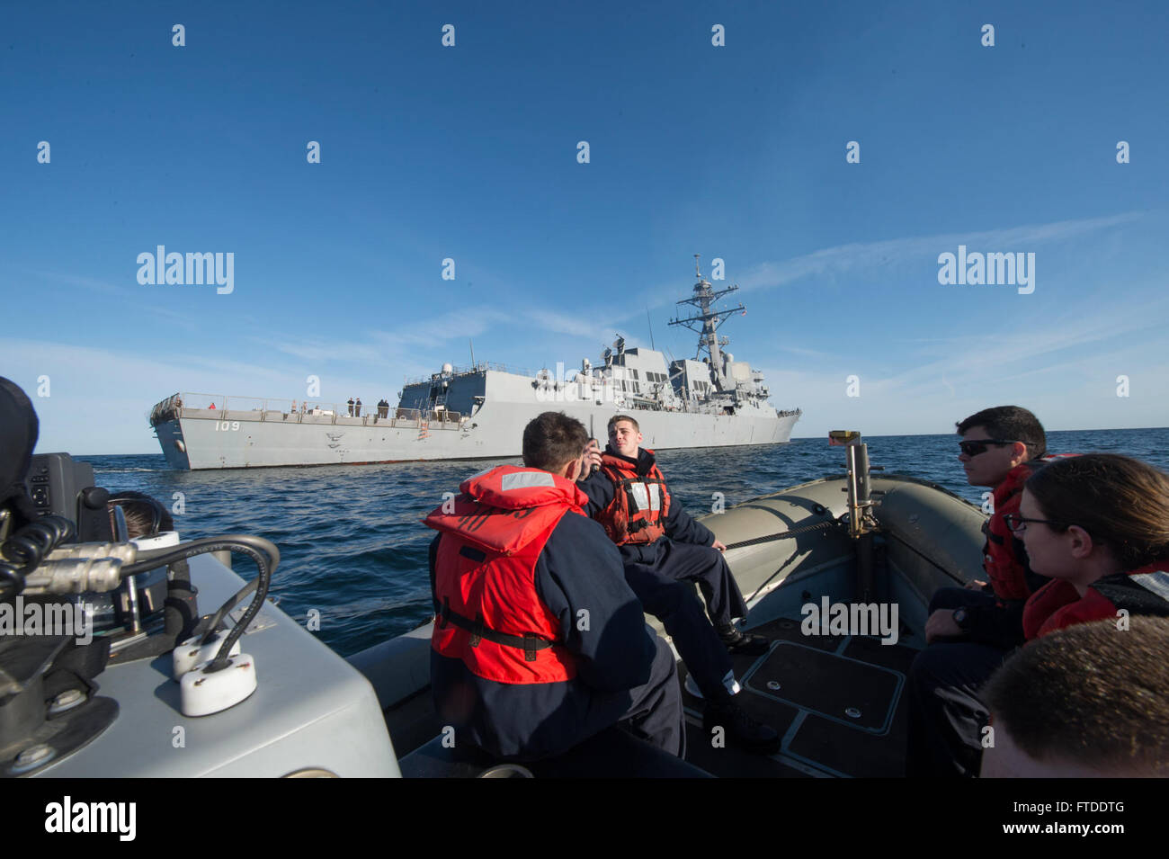 150617-N-ZE250-001 BALTIC SEA (June 17, 2015) Sailors ride in a rigid hull inflatable boat (RHIB) from the USS Jason Dunham (DDG 109) in route to Danish Navy Frigate HDMS Absalon (L16) for a tour of the allied vessel June 17, 2015. Jason Dunham, an Arleigh Burke-class guided-missile destroyer homeported in Norfolk, is participating in exercise Baltic Operations (BALTOPS) 2015. BALTOPS is an annually recurring multinational exercise designed to enhance flexibility and interoperability, as well as demonstrate resolve of Allied and partner forces to defend the Baltic region. (U.S. Navy photo by M Stock Photo