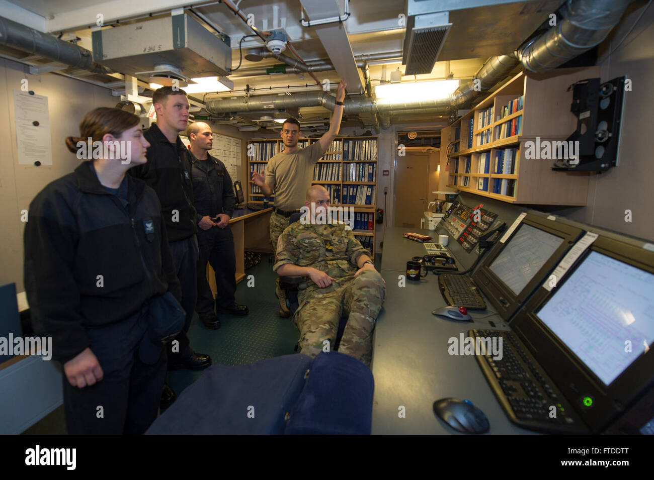 150617-N-ZE250-042 BALTIC SEA (June 17, 2015) Sailors from USS Jason Dunham (DDG 109) tour the central control station aboard Danish Navy Frigate HDMS Absalon (L16) June 16, 2015. Jason Dunham, an Arleigh Burke-class guided-missile destroyer homeported in Norfolk, is participating in exercise Baltic Operations (BALTOPS) 2015. BALTOPS is an annually recurring multinational exercise designed to enhance flexibility and interoperability, as well as demonstrate resolve of Allied and partner forces to defend the Baltic region. (U.S. Navy photo by Mass Communication Specialist 3rd Class Weston Jones/ Stock Photo