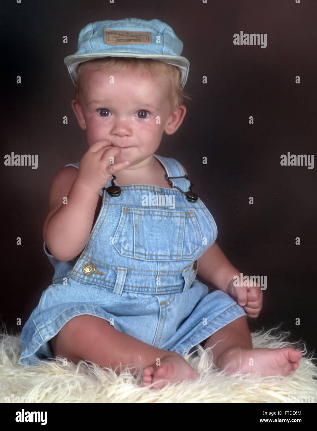 baby dressed in denim Stock Photo