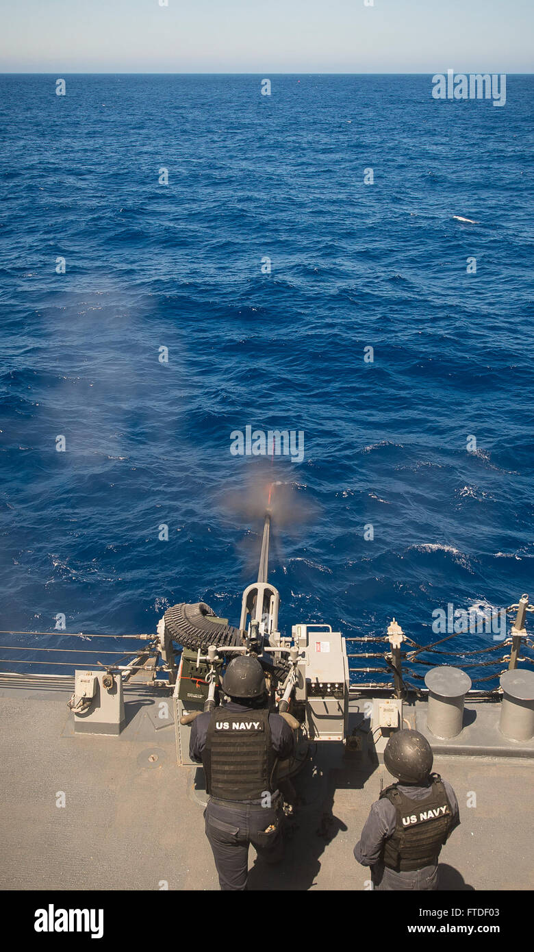 150719-N-FQ994-227 MEDITERRANEAN SEA (July 19, 2015) Gunner's Mate 2nd Class Alex Scott, from Blue Bell, Pennsylvania, shoots a Mark34 25-mm chain gun aboard USS Ross (DDG 71) during a live fire demonstration for civilian Tiger Cruise participants July 19, 2015.  Ross, an Arleigh Burke-class guided-missile destroyer, forward-deployed to Rota, Spain, is conducting naval operations in the U.S. 6th Fleet area of operations in support of U.S. national security interests in Europe.  (U.S. Navy photo by Mass Communication Specialist 3rd Class Robert S. Price/Released) Stock Photo