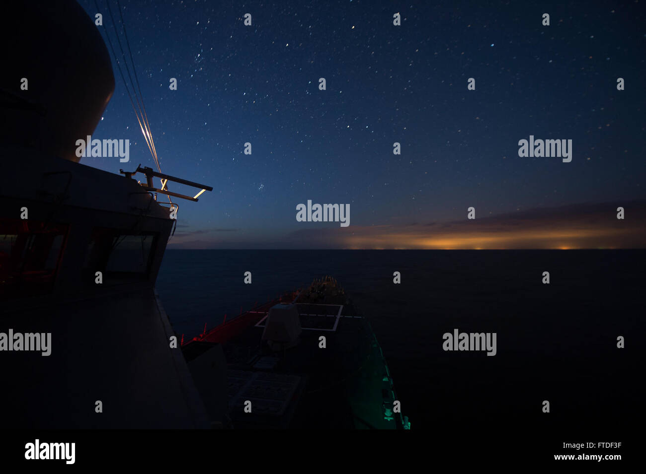 150724-N-ZE250-014 BALTIC SEA (July 23, 2015) USS Jason Dunham (DDG 109) operates at night in the Baltic Sea July 24, 2015. Jason Dunham, an Arleigh Burke-class guided-missile destroyer homeported in Norfolk, is conducting naval operations in the U.S. 6th Fleet area of operations in support of U.S. national security interests in Europe. (U.S. Navy photo by Mass Communication Specialist 3rd Class Weston Jones/Released) Stock Photo
