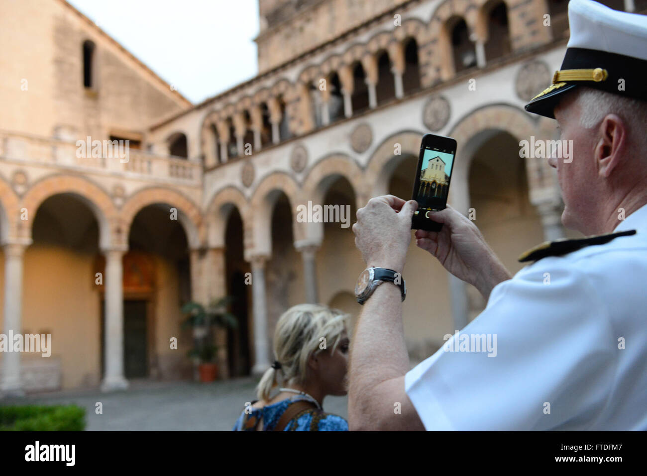 150909-N-SS492-134 SALERNO, Italy (Sept. 9, 2015) Commander, U.S. 6th Fleet, Vice Adm. James G. Foggo III takes a photo of St. Matthew’s Cathedral during a visit Sept. 9, 2015. Foggo visited the town to commemorate the anniversary of the liberation of Salerno and attend a nearby concert by the U. S. Naval Forces Europe Band. (U.S. Navy photo by Chief Mass Communication Specialist (select) Brian P. Biller/Released) Stock Photo