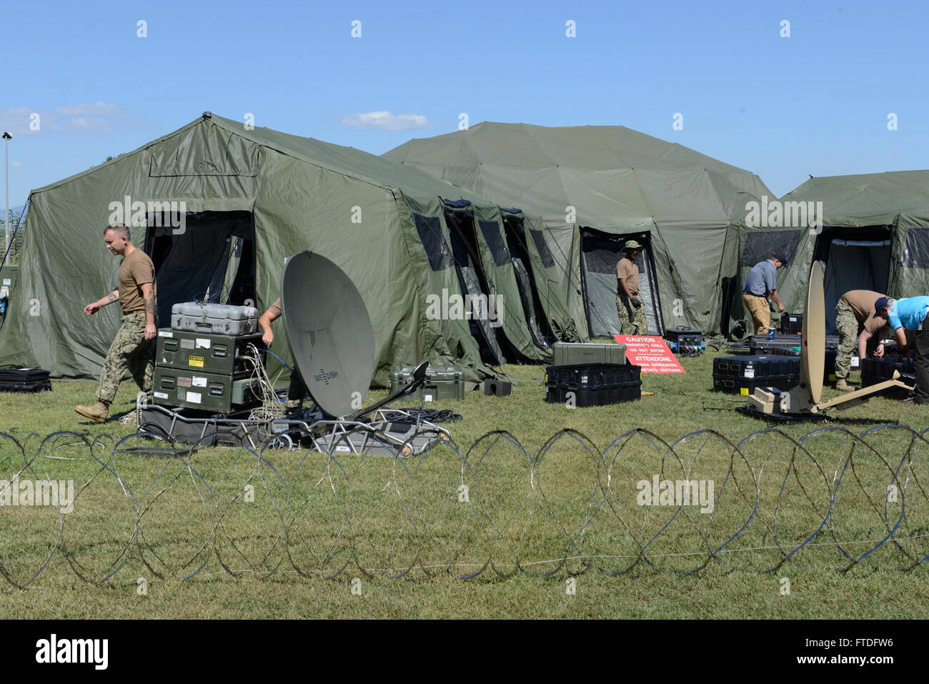 150921-N-UE250-070 GRICIGNANO, Italy (Sept. 21, 2015) Sailors assigned to Commander, Naval Forces Europe Det. Maritime Ashore Support Team (MAST) set up their mobile command center on U.S. Naval Support Activity Naples, Italy Sept. 21, 2015. MAST is currently conducting a Continuity of Operations Planning and crisis management field training exercise. (U.S. Navy photo by Mass Communication Specialist 2nd Class Corey Hensley/Released) Stock Photo