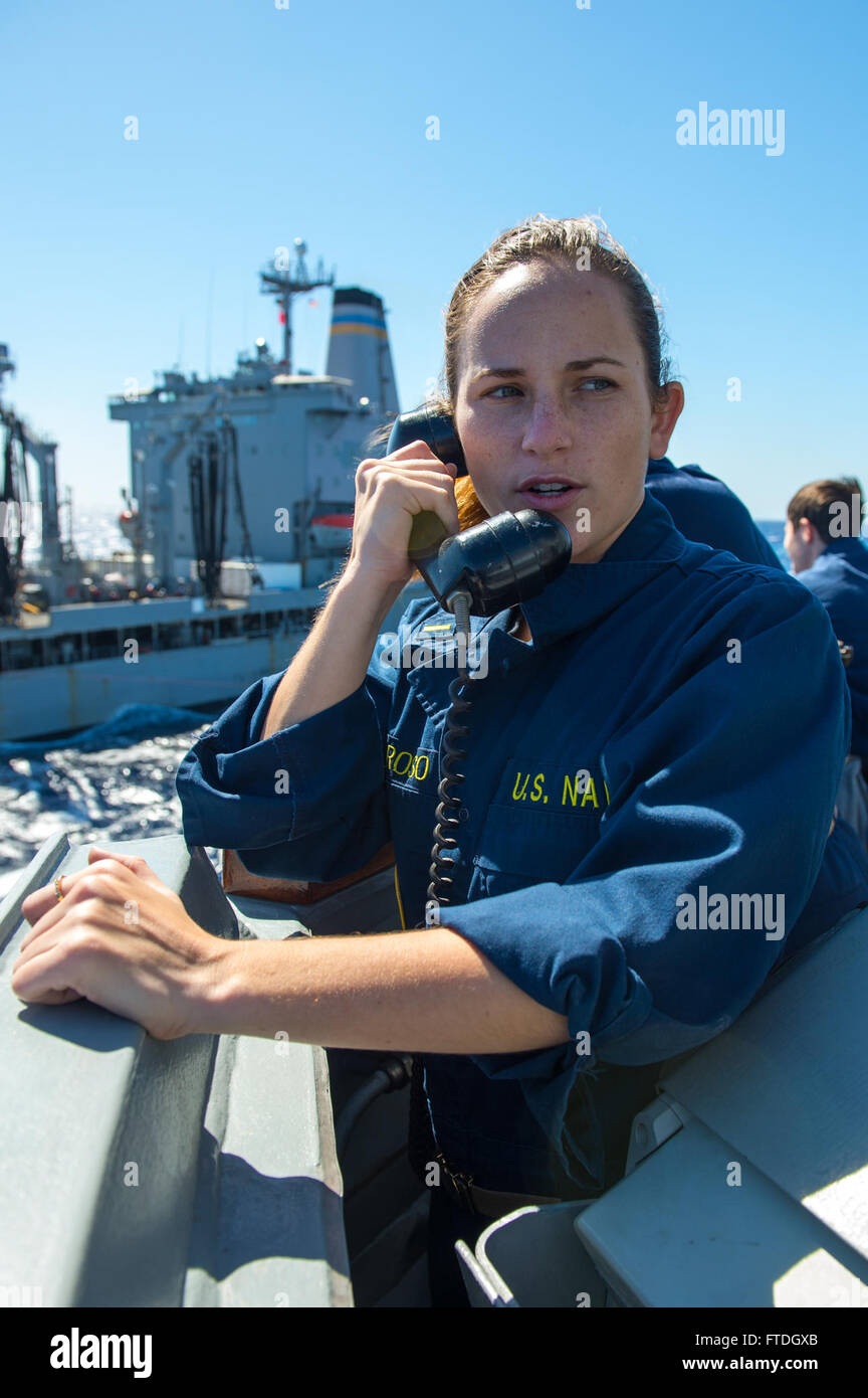 131009-N-NU634-039: MEDITERRANEAN SEA (Oct. 9, 2013) – Ensign Brooke Amoroso provides orders to the helmsman during a replenishment-at-sea with Military Sealift Command replenishment oiler USNS Laramie (T-AO-203) aboard the Arleigh Burke-class guided missile destroyer USS Gravely (DDG 107). Gravely, homeported in Norfolk, Va., is on a scheduled deployment supporting maritime security operations and theater security cooperation efforts in the U.S. 6th Fleet area of responsibility. (U.S. Navy photo by Mass Communication Specialist 3rd Class Darien G. Kenney/Released) Stock Photo