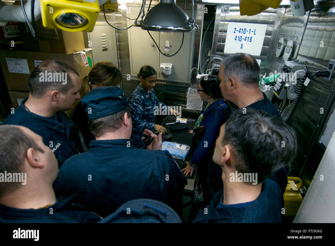 151021-N-AX546-126 BLACK SEA (Oct. 21, 2015) Hospital Corpsman 2nd Class Dhana McKinney, from Staten Island, New York, shows members of the Georgian Coast Guard the battle dressing station aboard USS Porter (DDG 78) during a bilateral training exercise Oct. 21, 2015. Porter, an Arleigh Burke-class guided-missile destroyer, forward-deployed to Rota, Spain, is on a routine patrol conducting naval operations in the U.S. 6th Fleet area of operations in support of U.S. national security interests in Europe. (U.S. Navy photo by Mass Communication Specialist 1st Class Sean Spratt/Released) Stock Photo