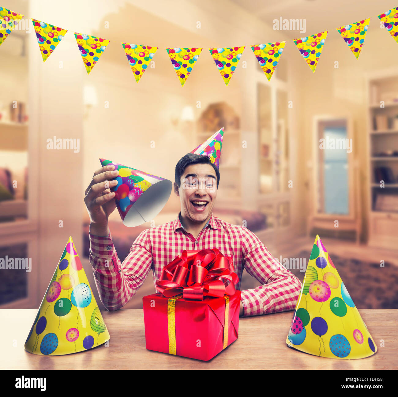 Man playing with Birthday hats Stock Photo Alamy