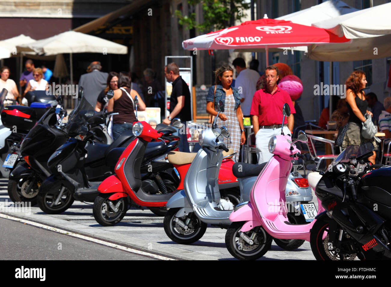 Motor scooters parked on pavement in city centre , Vigo , Galicia , Spain  Stock Photo - Alamy