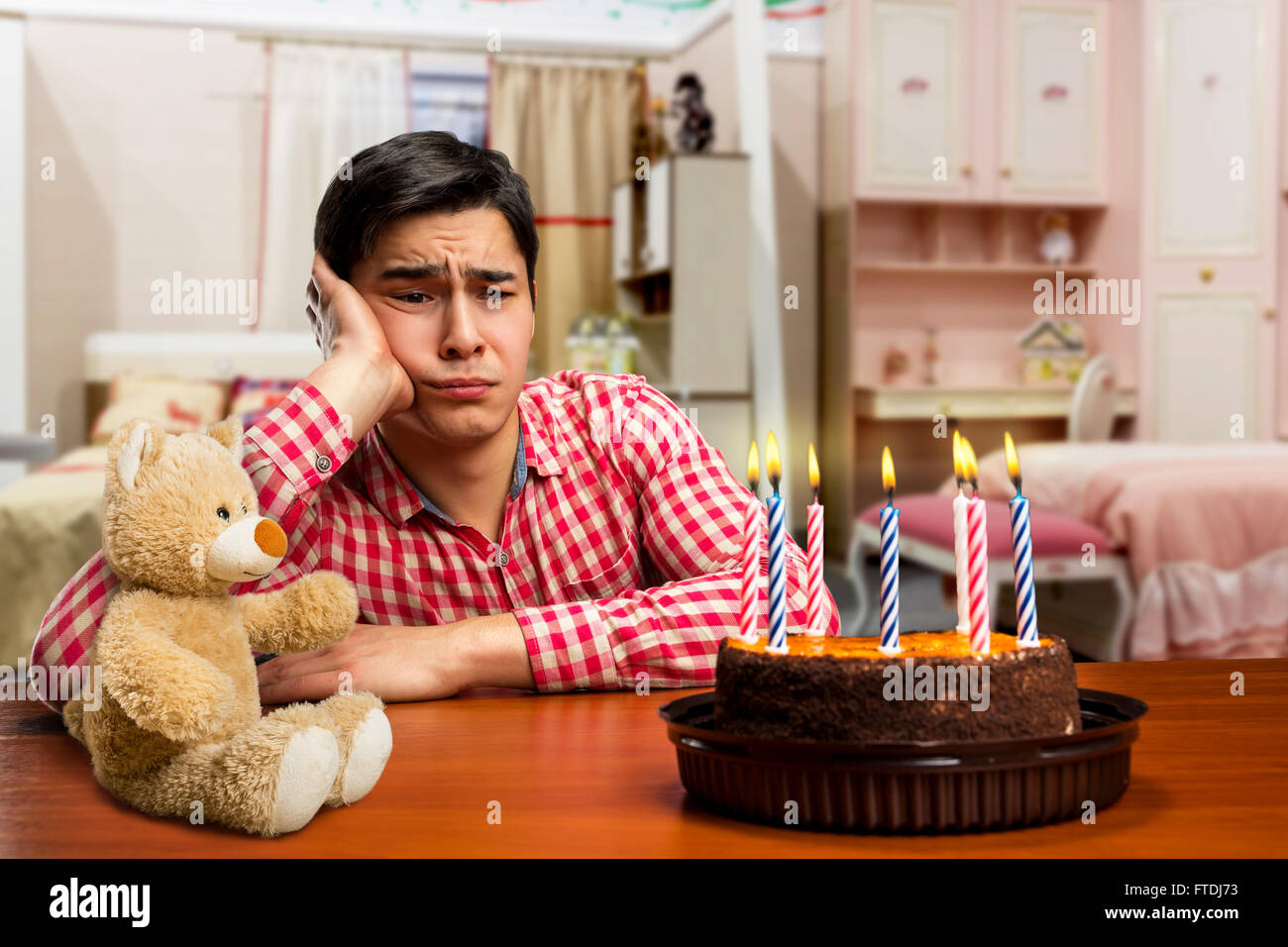 Sad birthday boy Stock Photo