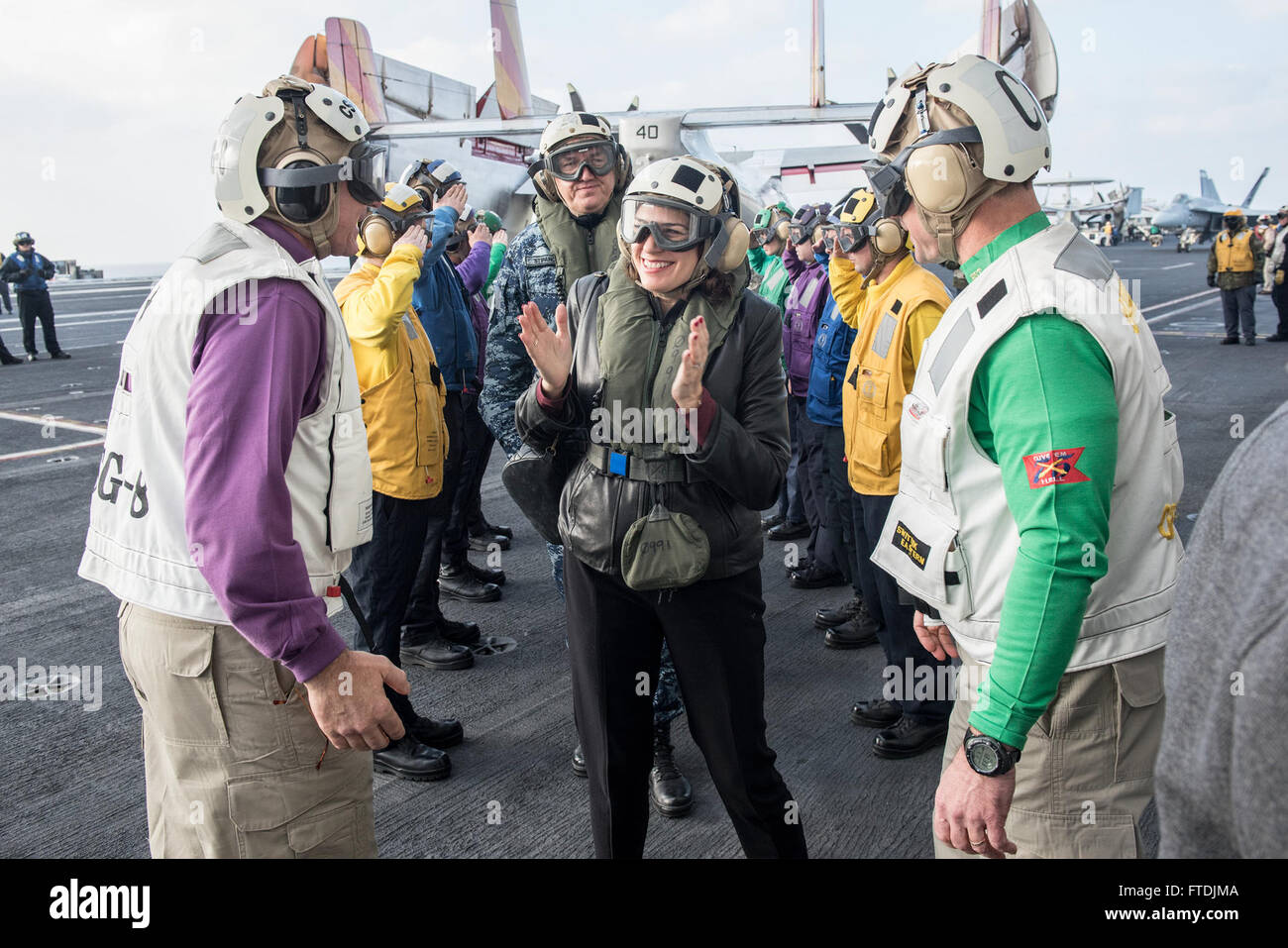 151209-N-DZ642-007 MEDITERRANEAN SEA (Dec. 9, 2015) Julieta Valls Noyes, U.S. Ambassador to Croatia, is welcomed aboard aircraft carrier USS Harry S. Truman (CVN 75) by Rear Adm. Bret Batchelder, commander, Carrier Strike Group Eight, left, and Capt. Ryan Scholl, Truman's commanding officer, right. Harry S. Truman Carrier Strike Group is conducting naval operations in the U.S. 6th Fleet area of operations in support of U.S. national security interests in Europe and Africa. (U.S. Navy photo by Mass Communication Specialist 3rd Class B. Siens/Released) Stock Photo