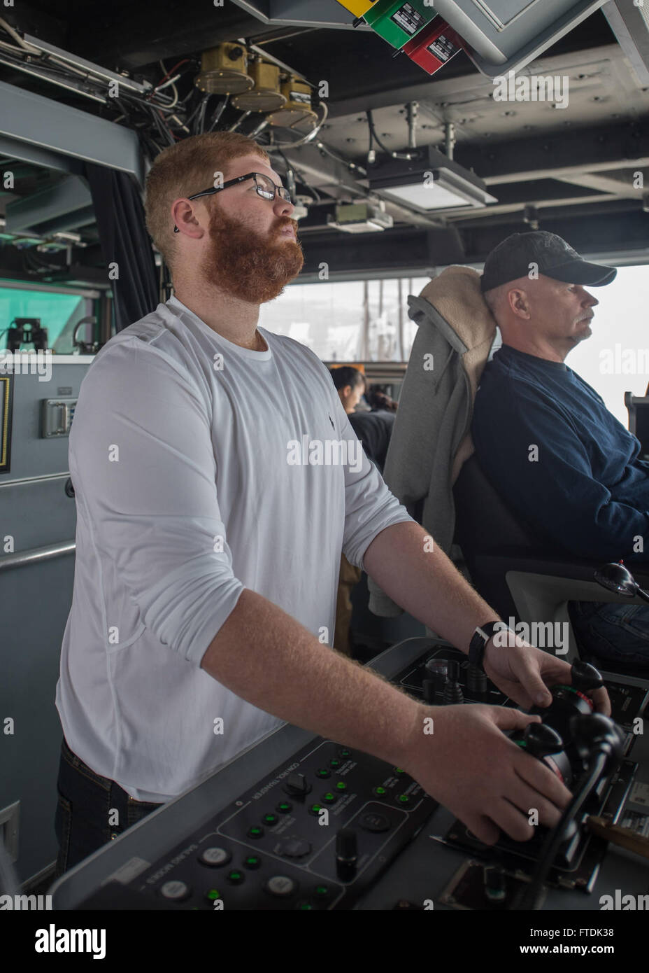 160104-N-WV703-001 ATLANTIC OCEAN (Jan. 4, 2016) 3rd Mate Alexander Spitz, a civil service mariner, maintains the ship’s course aboard USNS Spearhead (T-EPF 1) Jan. 4, 2015. The Military Sealift Command expeditionary fast transport vessel USNS Spearhead is on a scheduled deployment to the U.S. 6th Fleet area of operations to support the international collaborative capacity-building program Africa Partnership Station. (U.S. Navy photo by Mass Communication Specialist 3rd Class Amy M. Ressler/Released) Stock Photo