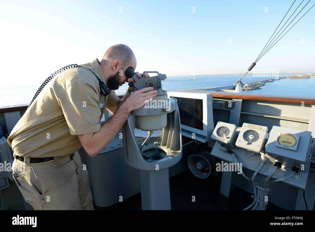 160226-N-VY489-022 LIMASSOL, Cyprus (Feb. 26, 2016) Lt. Benjamin McIntire, USS Mount Whitney (LCC 20) navigator, looks through a telescopic alidade as the flagship arrives in Limassol, Cyprus, for a scheduled port visit Feb. 26, 2016. Mount Whitney, the U.S. 6th Fleet command and control ship, forward deployed to Gaeta, Italy, is conducting naval operations in the U.S. 6th Fleet area of operations in support of U.S. National security interest in Europe. (U.S. Navy Photo by Mass Communication Specialist 1st Class Mike Wright/ Released) Stock Photo