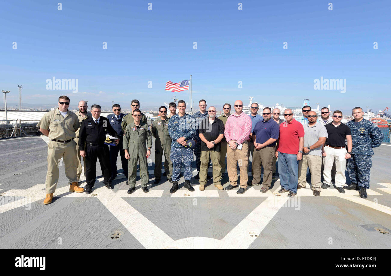 160227-N-VY489-065 LIMASSOL, Cyprus (Feb. 27, 2016) Commanding officer of the USS Mount Whitney (LCC 20), Capt. Carlos Sardiello, center, takes a photo with the Republic of Cyprus Joint Rescue Coordination Center personnel, and civilian contractors, after a meet and greet held aboard the ship Feb. 27, 2016. Mount Whitney, the U.S. 6th Fleet command and control ship, forward deployed to Gaeta, Italy, is conducting naval operations in the U.S. 6th Fleet area of operations in support of U.S. National security interests in Europe.(U.S. Navy Photo by Mass Communication Specialist 1st Class Mike Wri Stock Photo