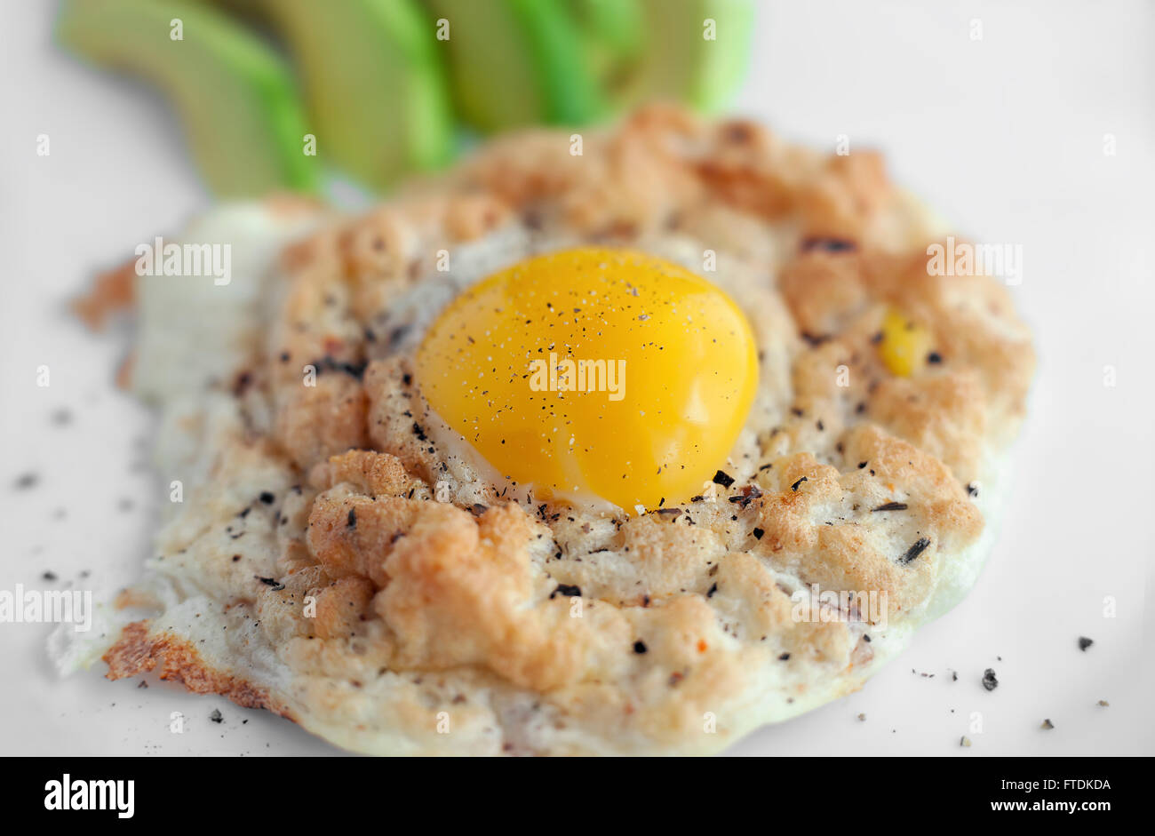Eggs in Clouds, a oven dish and cook the egg white and egg yolk separately. Stock Photo