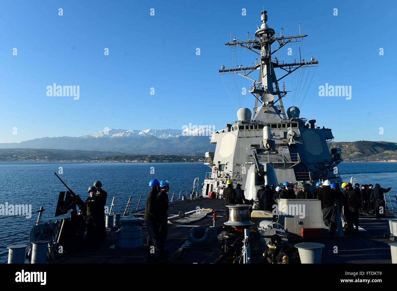 160202-N-FP878-123 SOUDA BAY, Greece (Feb. 2, 2016) USS Carney (DDG 64) departs Souda Bay, Greece, Feb. 2, 2016.  Carney, an Arleigh Burke-class guided-missile destroyer, forward deployed to Rota, Spain, is conducting a routine patrol in the U. S. 6th Fleet area of operations in support of U.S. national security interests in Europe. (U.S. Navy photo by Mass Communication Specialist 1st Class Theron J. Godbold/Released) Stock Photo