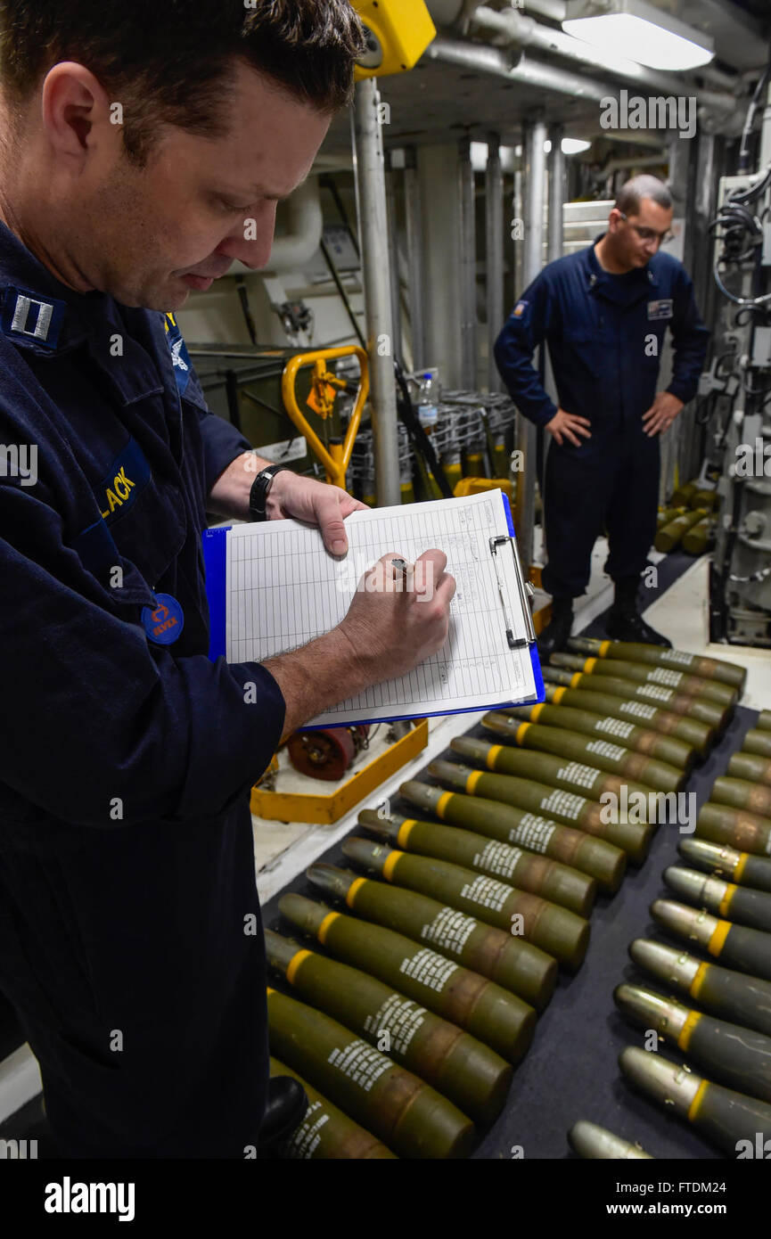 160204-N-FP878-090 MEDITERRANEAN SEA (Feb. 4, 2016) Lt. James Black from Detroit, and Gunner’s Mate 1st Class Armando Rodriguez from the Bronx, New York, take inventory of five inch ammunition aboard USS Carney (DDG 64) Feb. 4, 2016. Carney, an Arleigh Burke-class guided-missile destroyer, forward deployed to Rota, Spain, is conducting a routine patrol in the U. S. 6th Fleet area of operations in support of U.S. national security interests in Europe. (U.S. Navy photo by Mass Communication Specialist 1st Class Theron J. Godbold/Released) Stock Photo