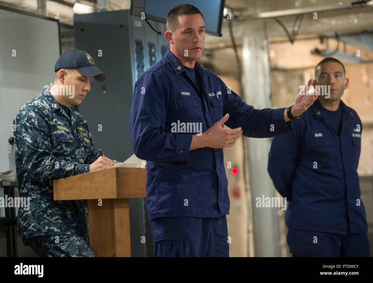 160215-N-WV703-039 SEKONDI, Ghana (Feb. 15, 2016) Chief Operations Specialist Jason Frivance, a member of the U.S. Coast Guard Law Enforcement Detachment, addresses Ghanaian navy and combined boarding team members along with U.S. Navy and U.S. Coast Guard during an exercise debrief aboard USNS Spearhead (T-EPF 1) Feb. 15, 2016. The Military Sealift Command expeditionary fast transport vessel USNS Spearhead is on a scheduled deployment in the U.S. 6th Fleet area of operations to support the international collaborative capacity-building program Africa Partnership Station. (U.S. Navy photo by Mas Stock Photo
