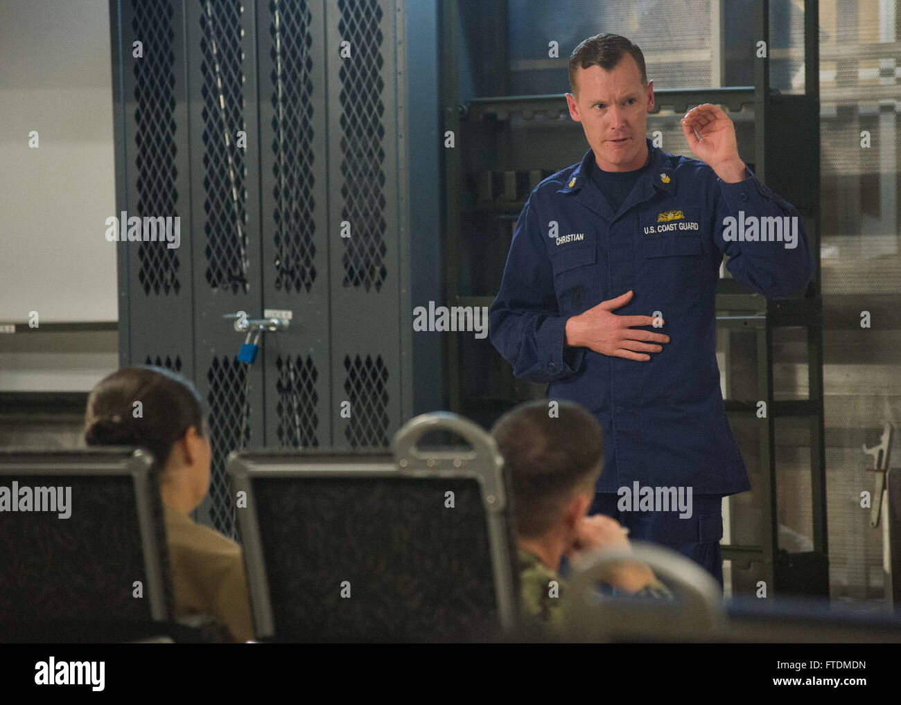Coast guard maritime enforcement specialist hires stock photography