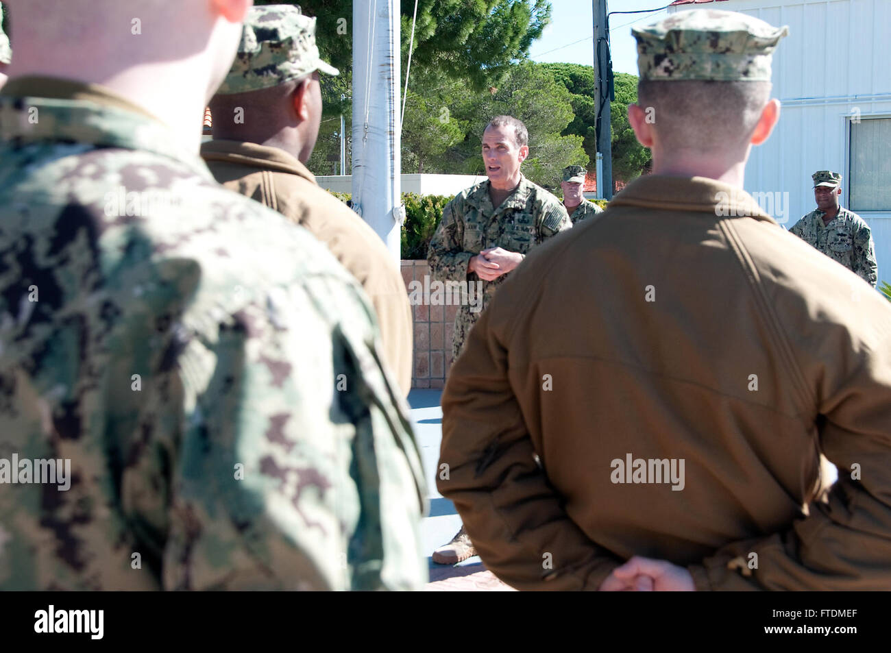 160216-N-MW990-034 NAVAL STATION ROTA, Spain (Feb. 16, 2016) Capt. Joseph Polanin, commander, Naval Expeditionary Task Force Europe and Africa, speaks to service members assigned to Naval Mobile Construction Battalion (NMCB) 133 during a turnover ceremony between NMCB 1 and NMCB 133 at Naval Station Rota, Spain, Feb. 16, 2016. The turnover marked the beginning of the NMCB 133 deployment to Rota’s Seabee camp, Camp Mitchell. U.S. 6th Fleet, headquartered in Naples, Italy, conducts the full spectrum of joint and naval operations, often in concert with allied, joint, and interagency partners, in  Stock Photo