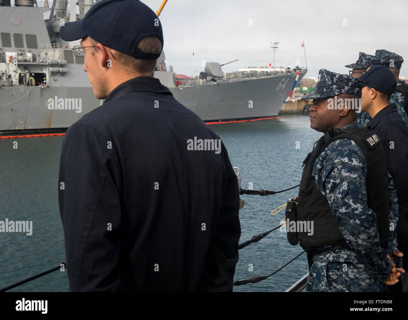 On March 16, 2016, USS Porter (DDG 78), an Arleigh Burke-class guided-missile destroyer, departs Rota, Spain, for a routine patrol. The sailors man the rails, a tradition that symbolizes the ship’s readiness for deployment, as the ship embarks on a mission in the U.S. 6th Fleet area. Stock Photo