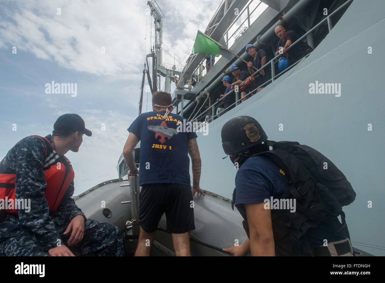 Sailors assigned to USNS Spearhead (T-EPF 1) approach the British oiler ...